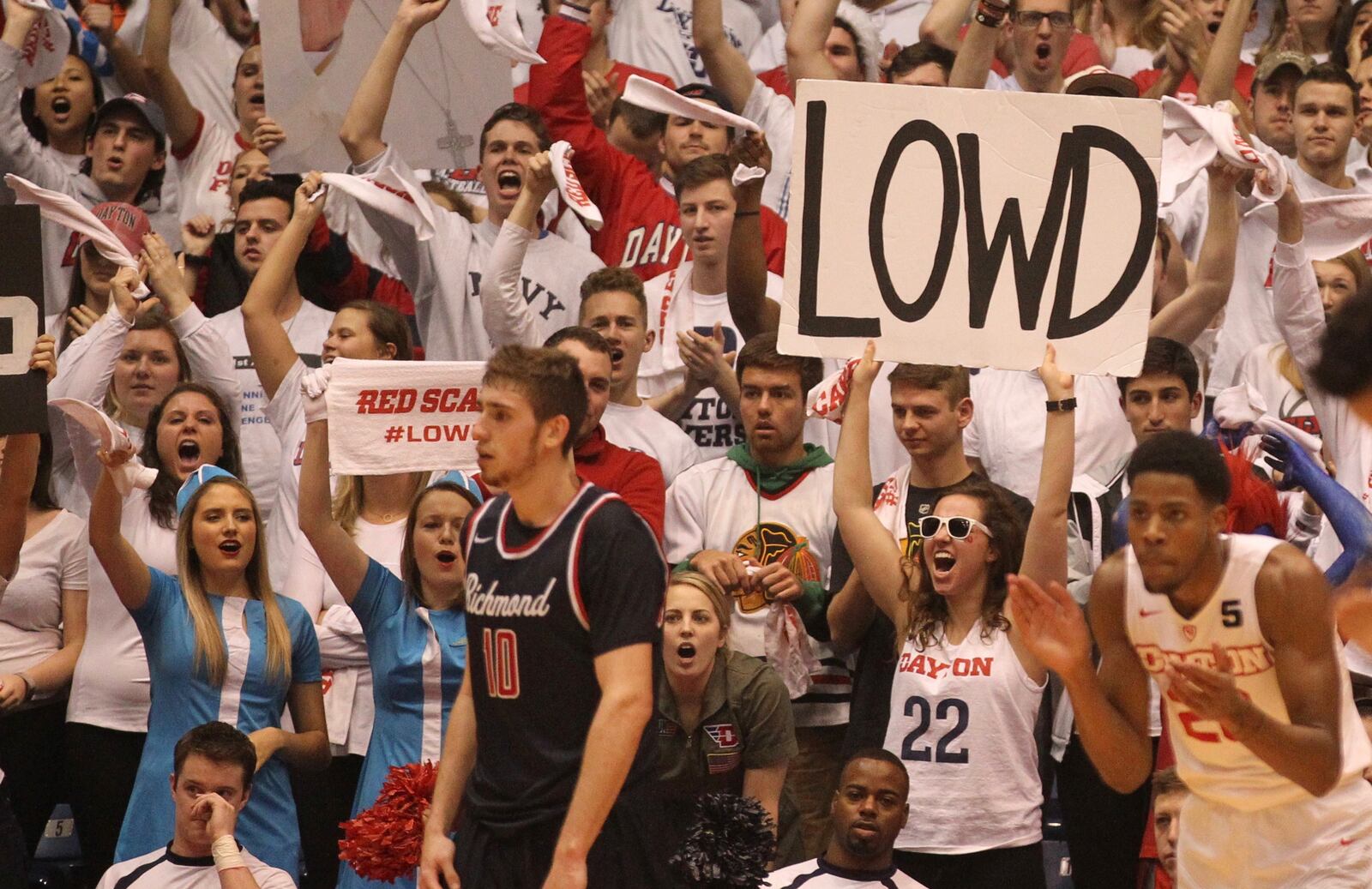 Dayton student Emily Lazar holds up a LOWD sign during a game against Richmond on Jan. 19, 2017.