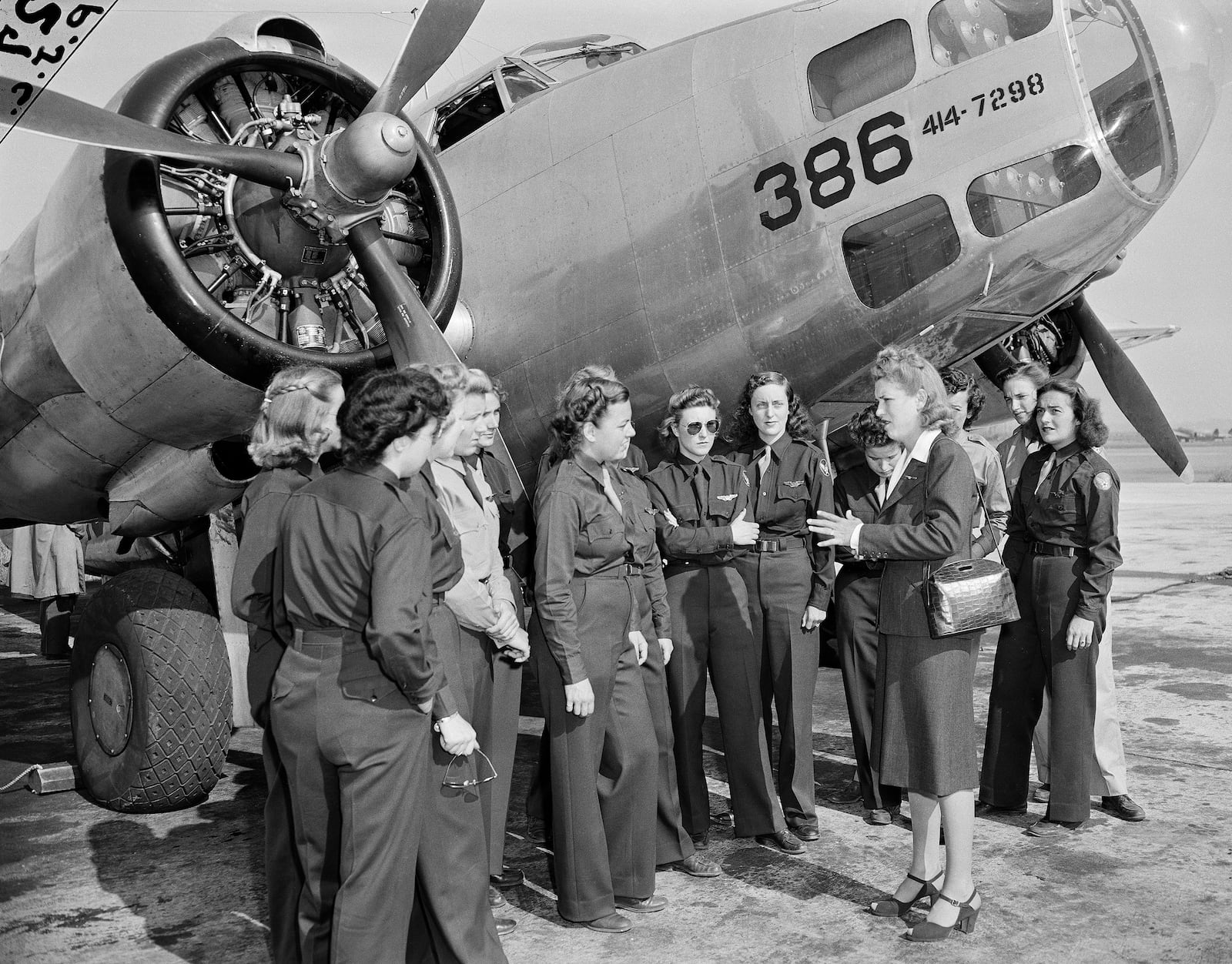 FILE - Jacqueline Cochran, director of Women Pilots for the Army Air Forces, talks to members of the Women Airforce Service Pilots before an AT10 plane at Camp Davis, N.C., Oct. 24, 1943. (AP Photo, File)