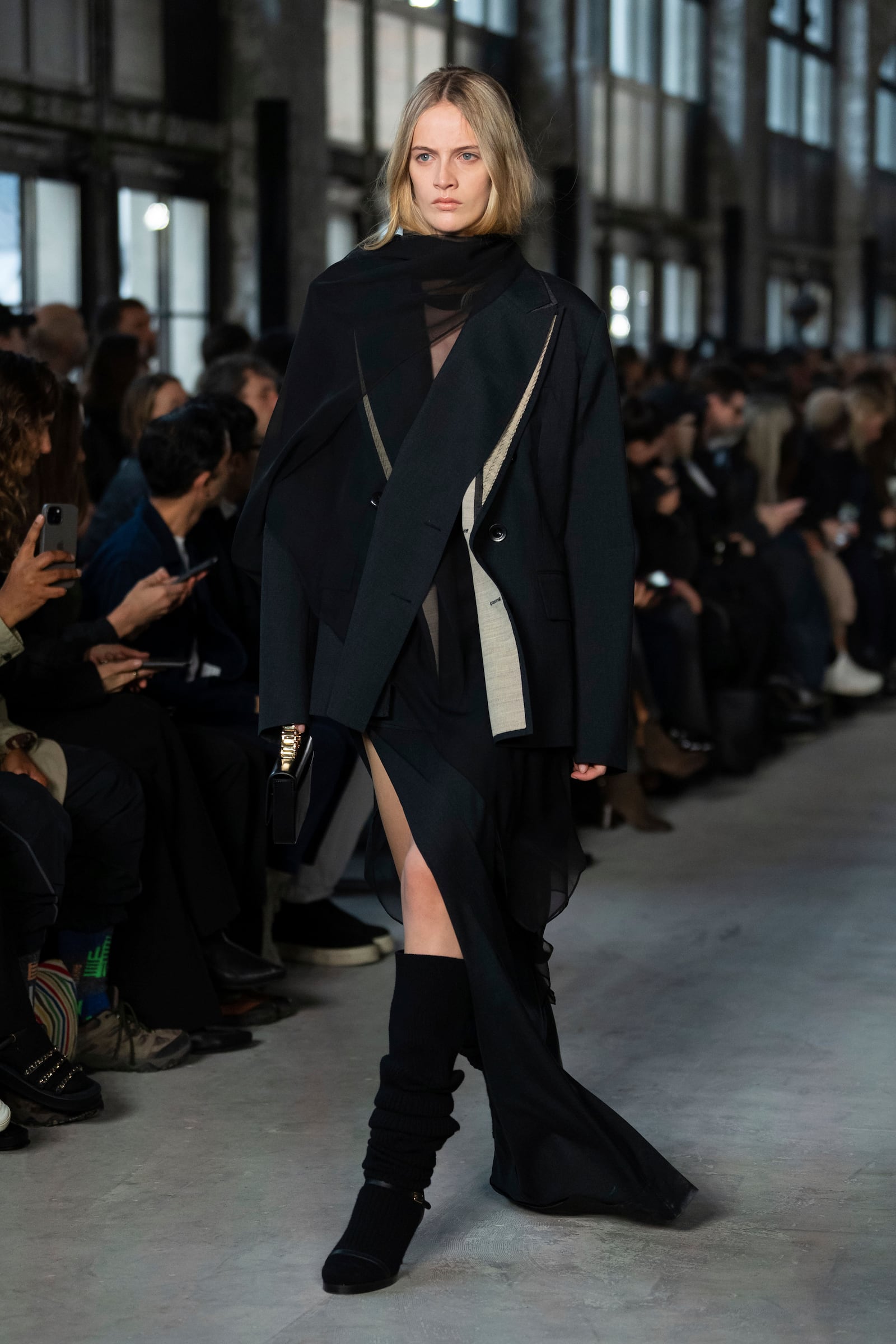 A model wears a creation as part of the Sacai Fall/Winter 2025-2026 Womenswear collection presented in Paris, Monday, March 10, 2025. (Photo by Scott A Garfitt/Invision/AP)