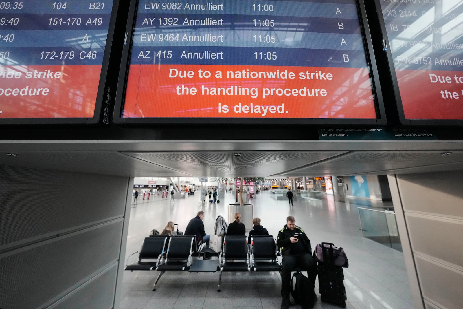 Flights are cancelled on a screen at the airport in Duesseldorf, Germany on Monday, March 10, 2025, when all major airports in Germany went on a warning strike. (AP Photo/Martin Meissner)