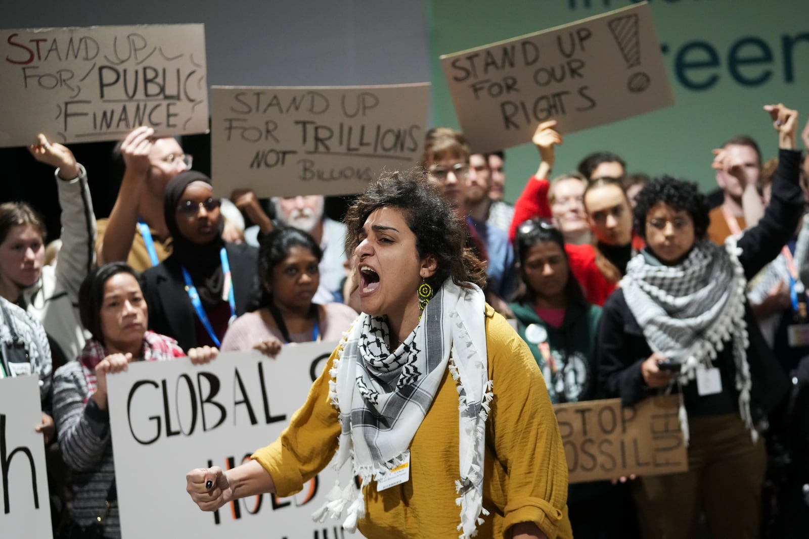 Activists participate in a demonstration for climate finance at the COP29 U.N. Climate Summit, Saturday, Nov. 23, 2024, in Baku, Azerbaijan. (AP Photo/Sergei Grits)