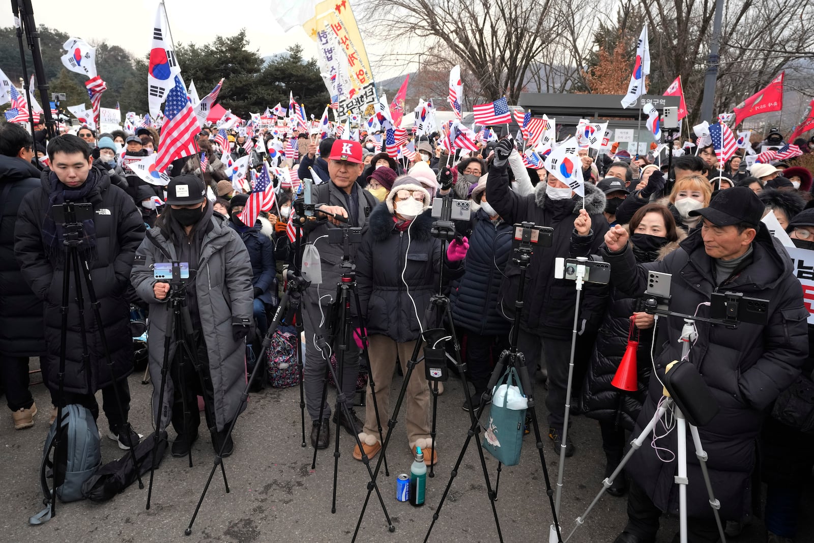 YouTubers work as supporters of impeached South Korean President Yoon Suk Yeol stage a rally to oppose his impeachment outside of a detention center in Uiwang, South Korea, Thursday, Jan. 16, 2025. (AP Photo/Ahn Young-joon)