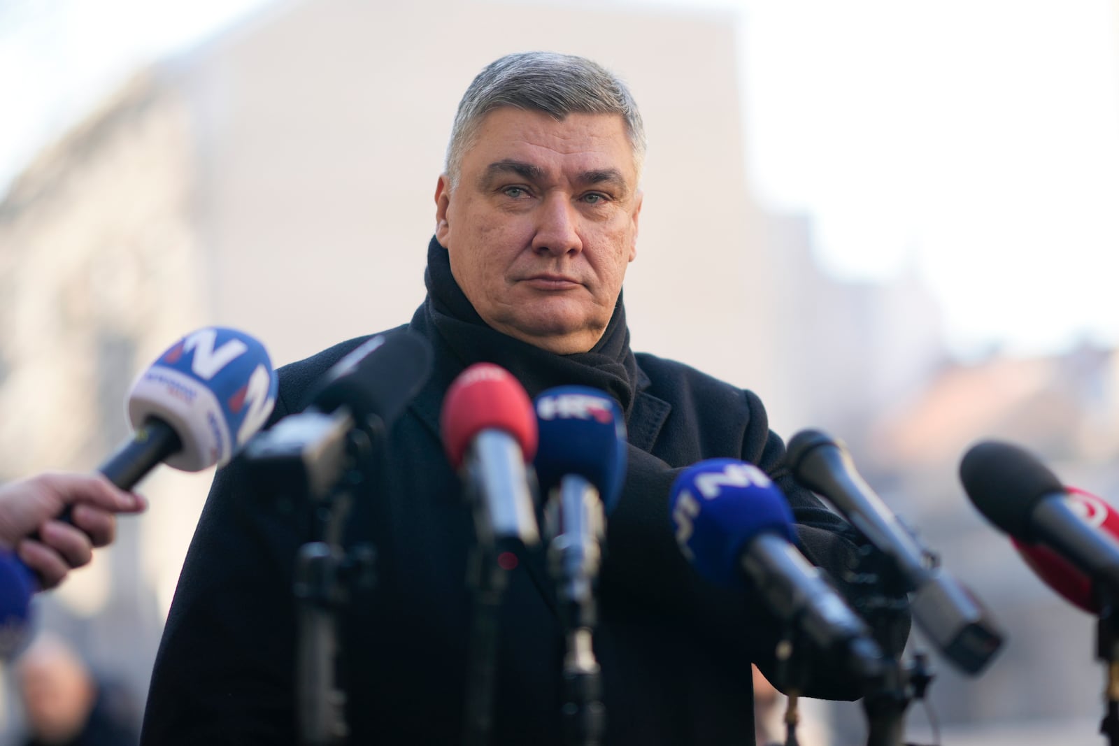 Croatia's President Zoran Milanovic speaks to the media after casting his ballot during presidential elections, at a polling station in Zagreb, Croatia, Sunday, Dec. 29, 2024. (AP Photo/Darko Bandic)