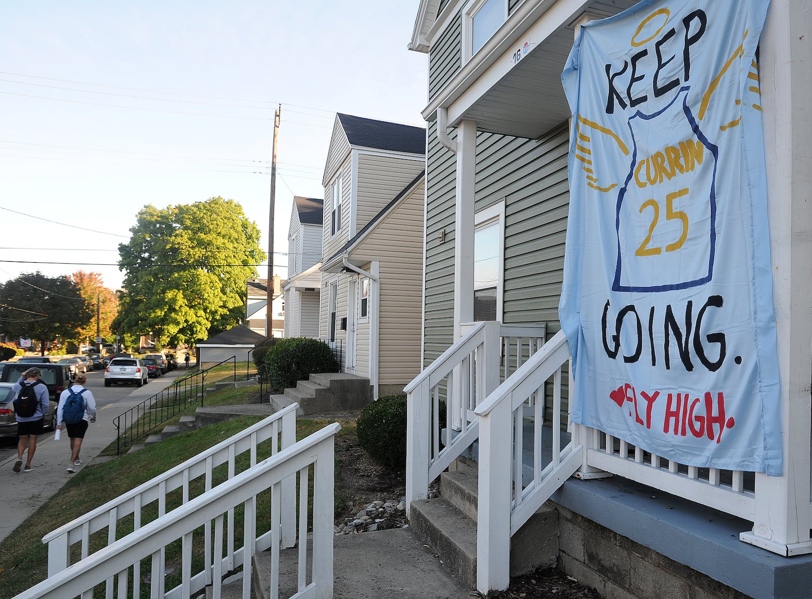 Many houses in the University of Dayton neighborhood have sheets hanging from the porches to honor student Michael Currin, who died Monday, Sept. 21, 2020. MARSHALL GORBY\STAFF