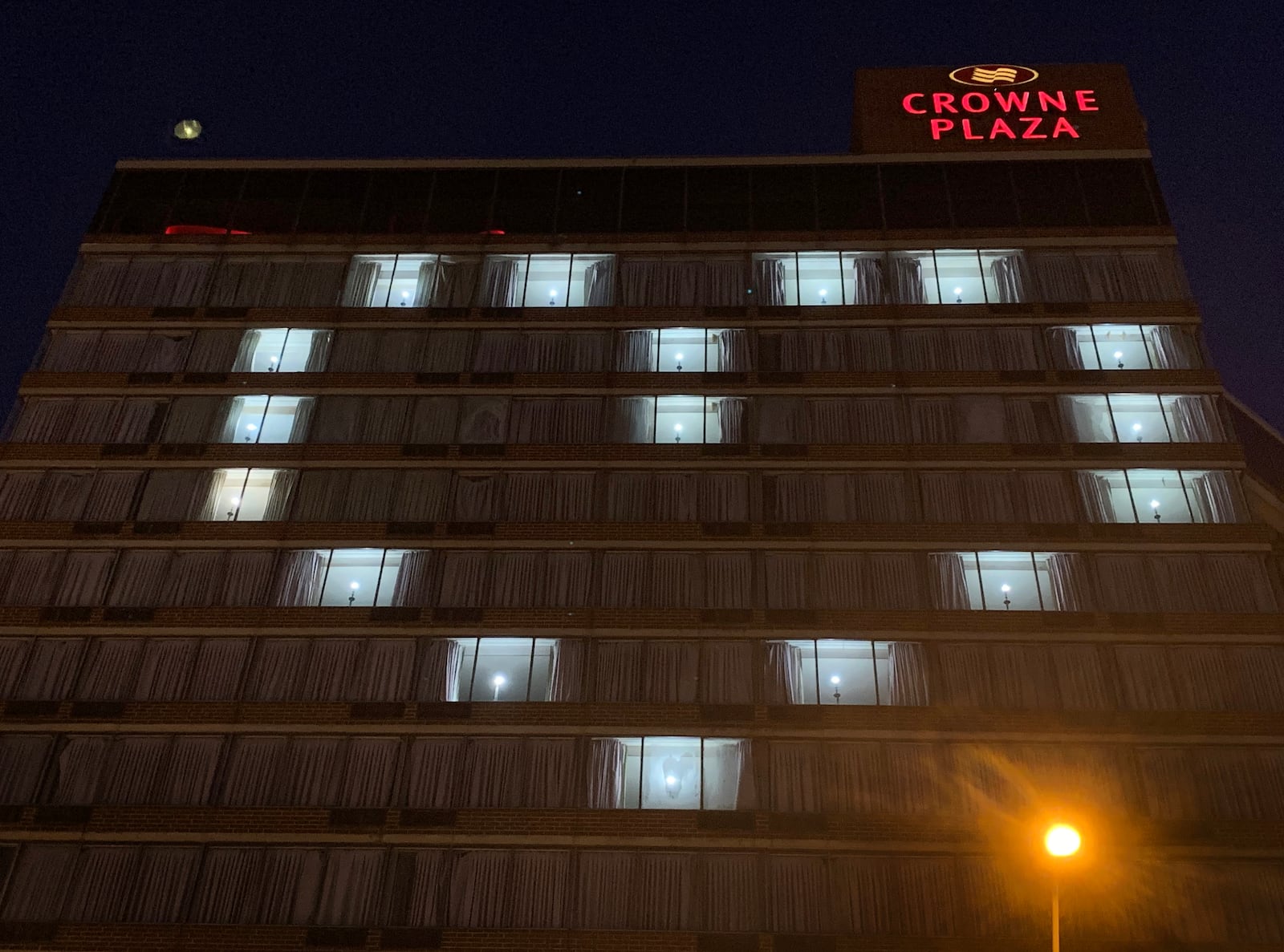 A beacon of love - a message during the coronavirus pandemic - is beaming from the Crowne Plaza Hotel in downtown Dayton. LISA POWELL / STAFF