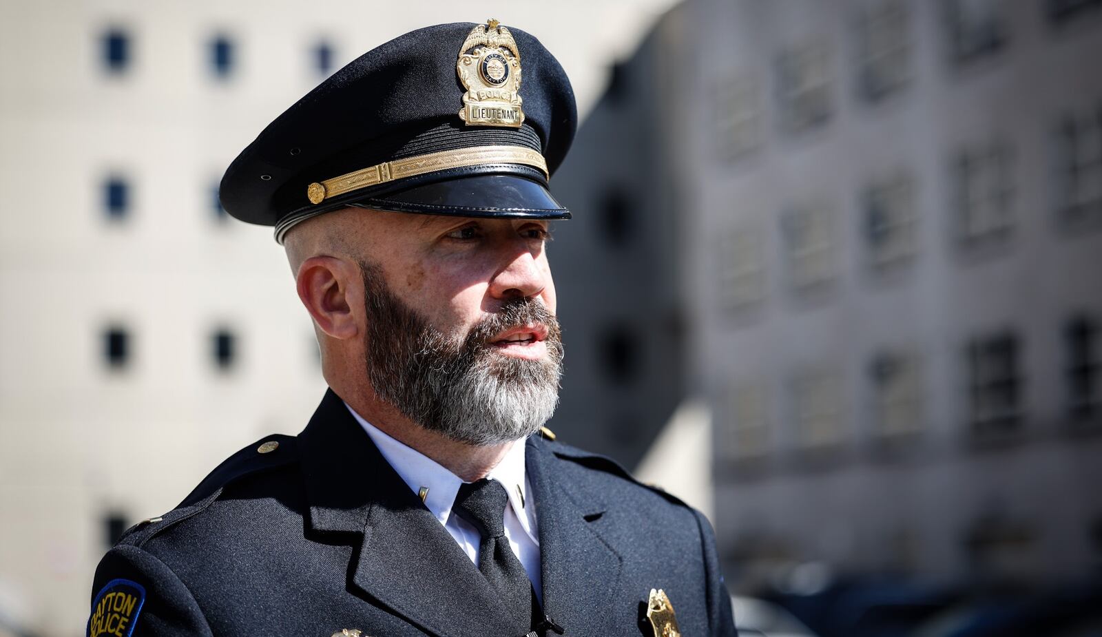 Lt. Jason Hall of the Dayton Police Department speaks about a double fatal shooting during a media briefing Monday, March 14, 2022, outside the city's public safety building. JIM NOELKER / STAFF