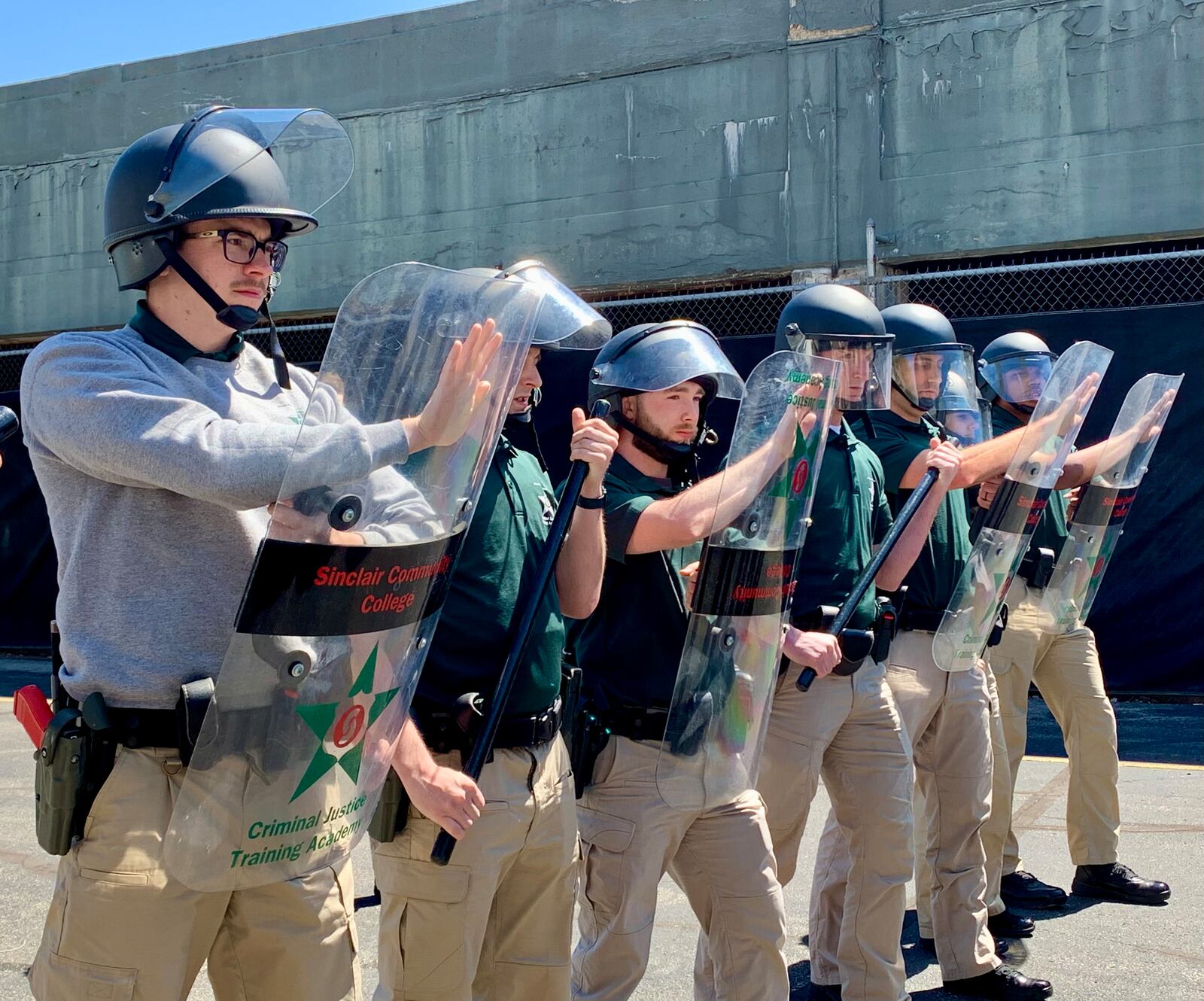 Sinclair Police Academy cadets in a line formation during civil disorder training. LONDON BISHOP/STAFF