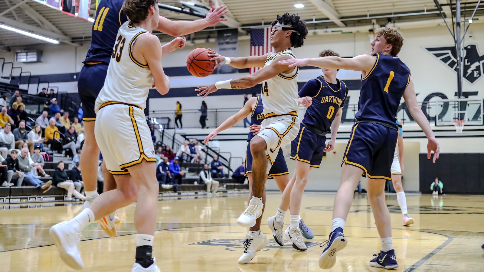 Alter's R.J. Greer makes a pass in traffic during a Division IV regional semifinal game on Tuesday, March 4 at Lakota East High School. MICHAEL COOPER/STAFF