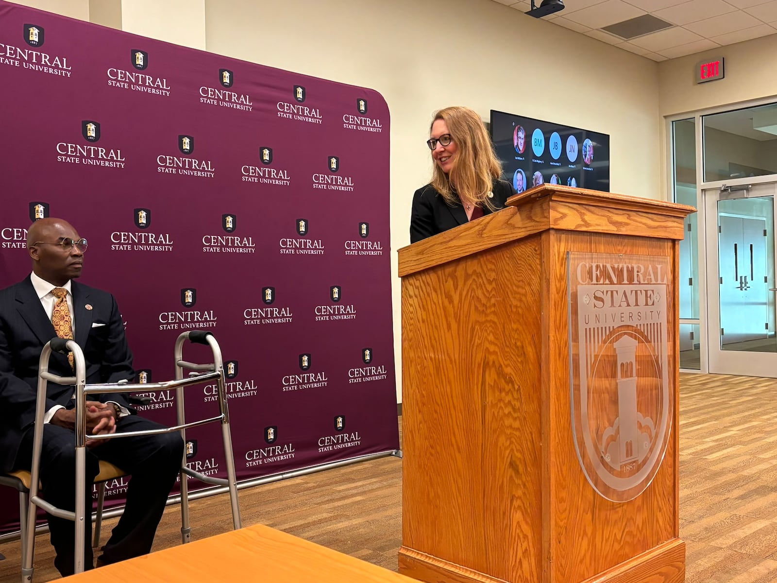 Amy Hobbs-Harris, Central State University's interim provost, looks at CSU's 10th president, Morakinyo A.O. Kuti, during at a press conference Thursday. Eileen McClory /staff