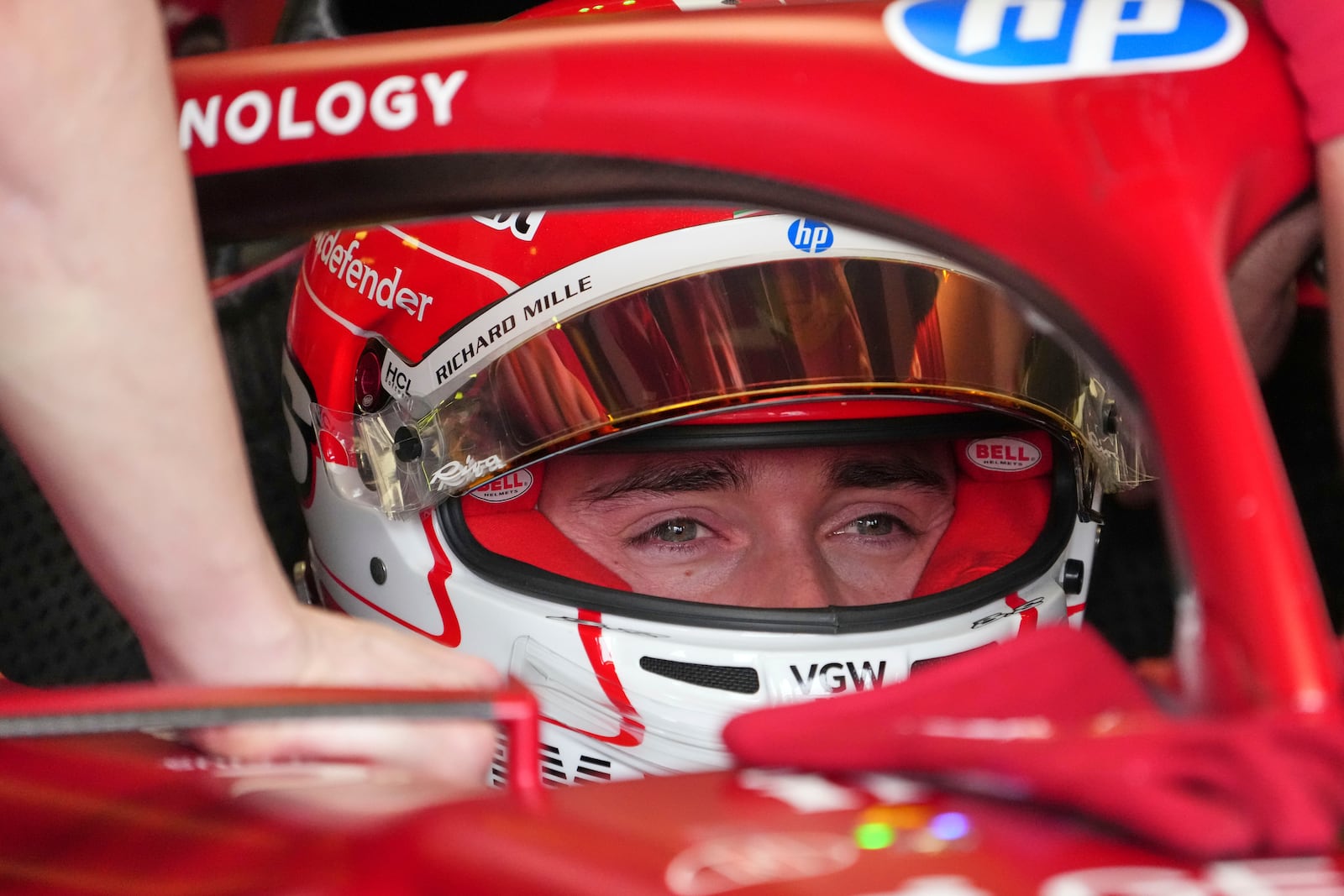 Ferrari driver Charles Leclerc of Monaco waits in his car during the third practice session at the Australian Formula One Grand Prix at Albert Park, in Melbourne, Australia, Saturday, March 15, 2025. (AP Photo/Scott Barbour)