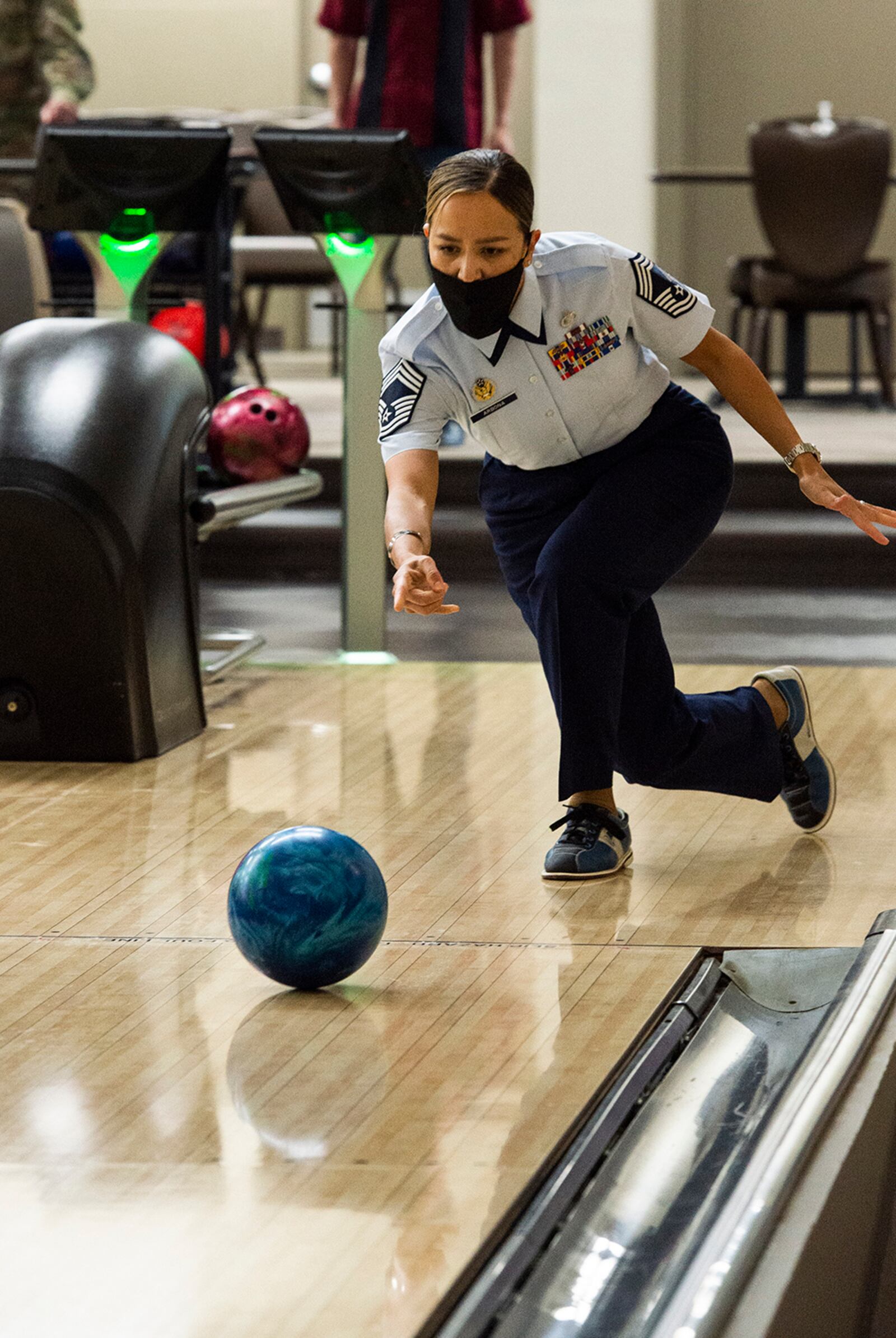 Chief Master Sgt. Rebecca Arbona, 88th Force Support Squadron superintendent, throws a ball down the lane during the Eagles vs. Chiefs Bowling Challenge. U.S. AIR FORCE PHOTO/FARNSWORTH