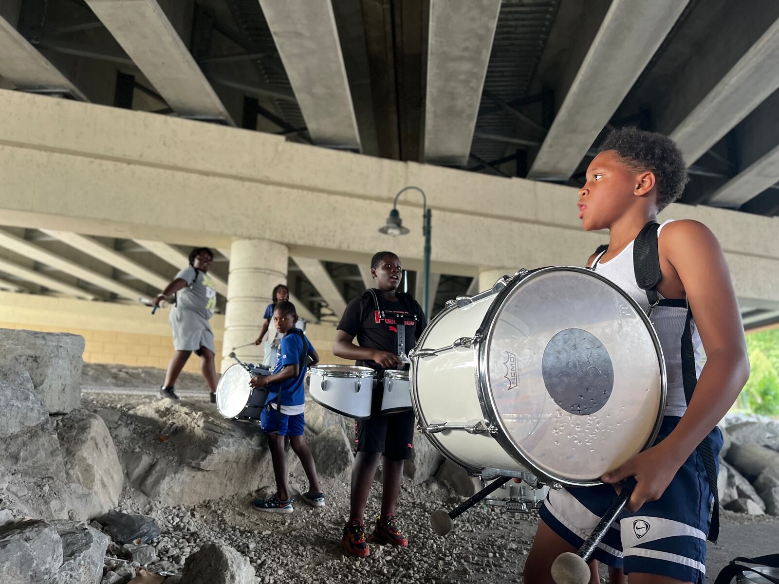 Members of the Western Stars Drill Team & Drum Line practice in a parking lot in downtown Dayton. CORNELIUS FROLIK / STAFF