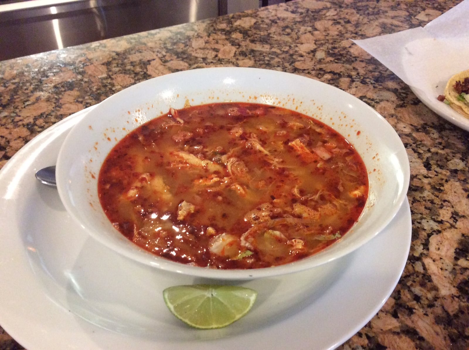 Pozole, a chicken and hominy soup with lettuce, radishes and lime, served by Chiapas Mexican Grill in Centerville. MARK FISHER/STAFF