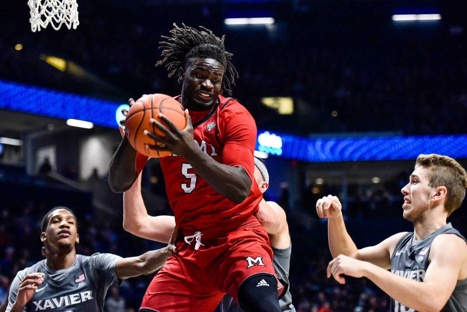 Miami's Precious Ayah grabs a rebound during their basketball game against Xavier Wednesday, Nov. 28 at Xavier's Cintas Center in Cincinnati. Xavier won 82-55. NICK GRAHAM/STAFF