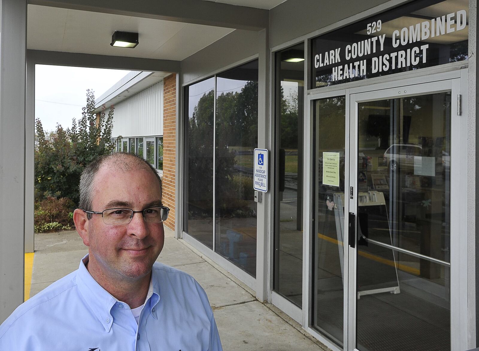 Clark County Health Commissioner Charles Patterson stands at the entrance to the Clark County Combined Health District building. Staff photo by Bill Lackey