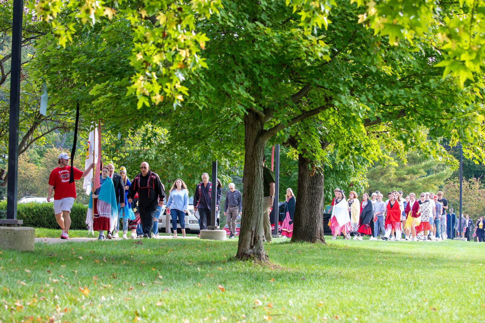 Miami Tribe students lead a processional through Miami University's campus on a Walk of Remembrance on Oct. 11, 2021. On Oct. 11, 1846, nearly 330 members of the Miami Tribe were removed from the homes in Oxford and relocated to what's now known as Kansans and eventually Oklahoma. PHOTO: MIAMI UNIVERSITY