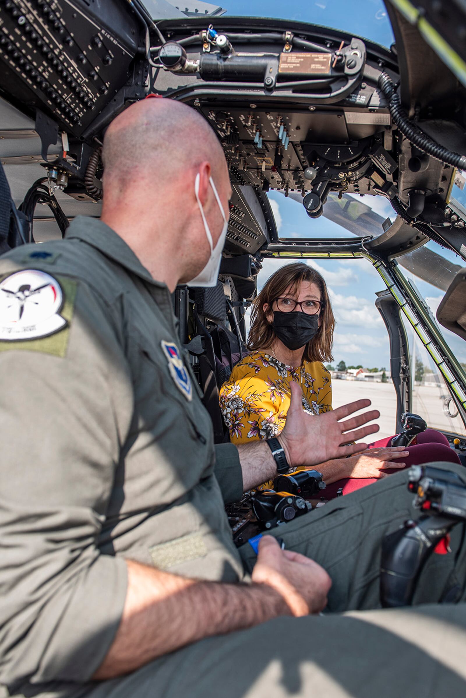 Lt. Col. Peter Sweeny, a pilot with the 512th Rescue Squadron out of Kirtland Air Force Base, New Mexico, talks with Diana Pry, a deputy program executive officer with the Air Force Life Cycle Management Center’s Intelligence, Surveillance, Reconnaissance and Special Operations Forces Directorate, during a tour of an HH-60W Jolly Green II helicopter Sept. 1 at Wright-Patterson Air Force Base. U.S. AIR FORCE PHOTO/WESLEY FARNSWORTH