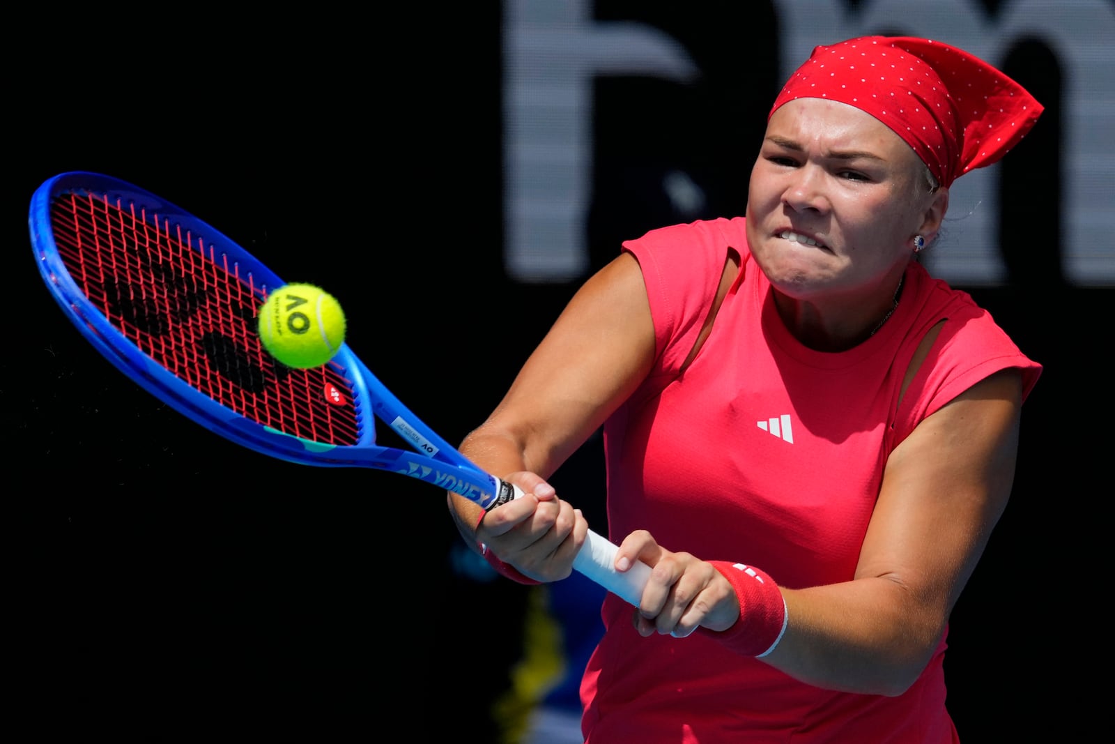 Diana Shnaider of Russia plays a backhand return to Donna Vekic of Croatia during their third round match at the Australian Open tennis championship in Melbourne, Australia, Friday, Jan. 17, 2025. (AP Photo/Vincent Thian)