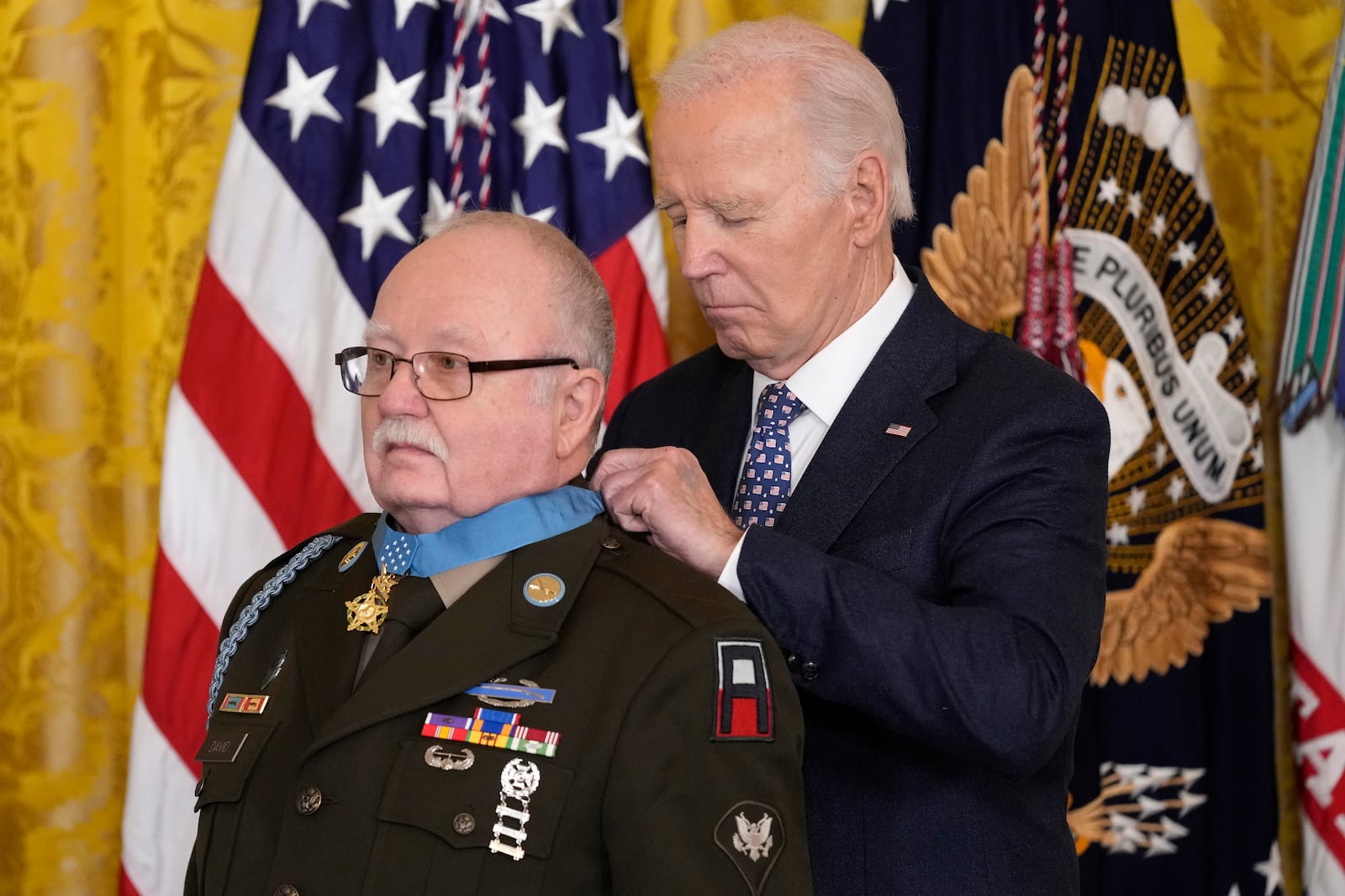 President Joe Biden presents the Medal of Honor, the nation's highest military decoration, to then-Private First Class Kenneth J. David, during a ceremony in the East Room of the White House in Washington, Friday, Jan. 3, 2025. (AP Photo/Susan Walsh)