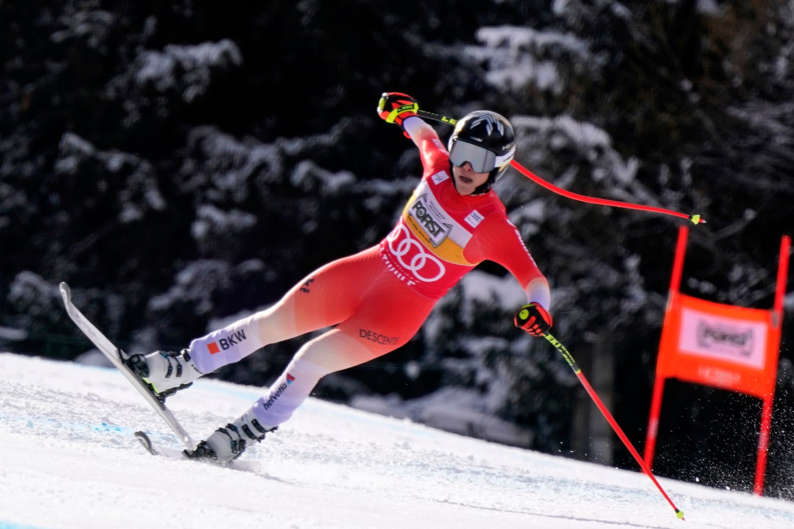 Switzerland's Lara Gut Behrami speeds down the course of an alpine ski, women's World Cup super G race, in La Thuile, Italy, Thursday, March 13, 2025. (AP Photo/Piermarco Tacca)