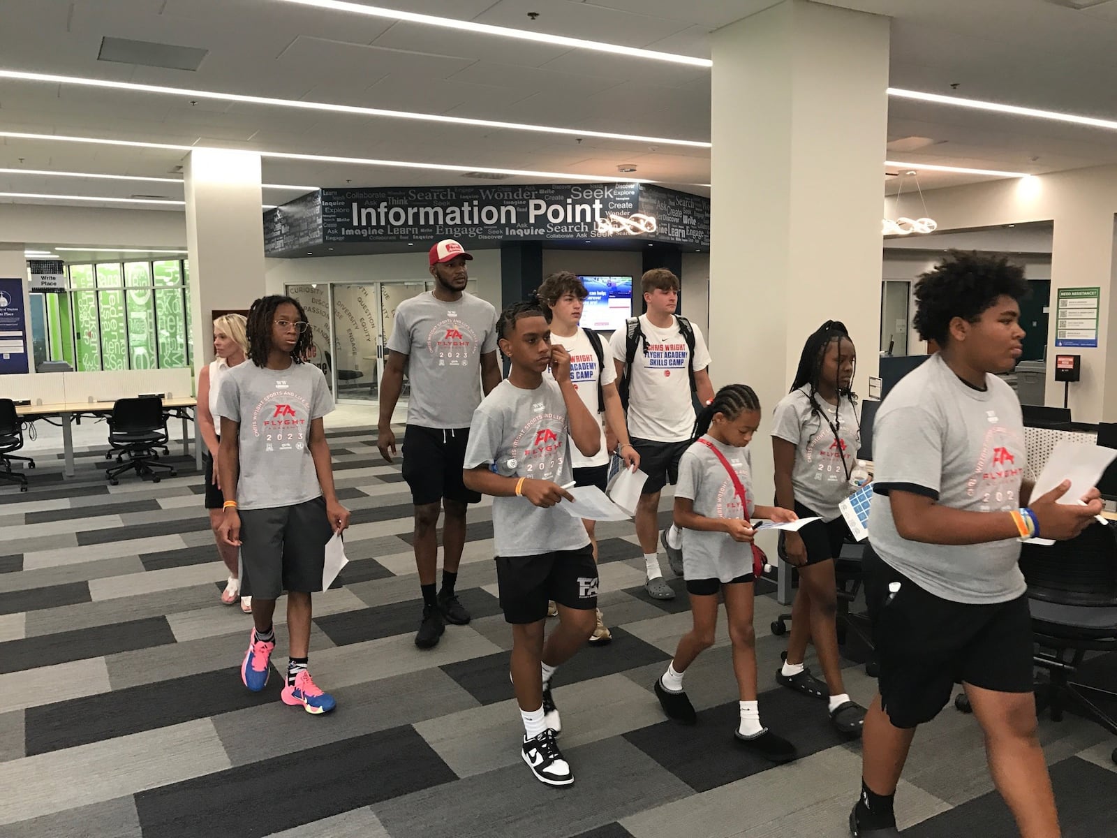 Chris Wright and some of the students in his camp tour the UD Library during  their tour Friday. Tom Archdeacon/CONTRIBUTED