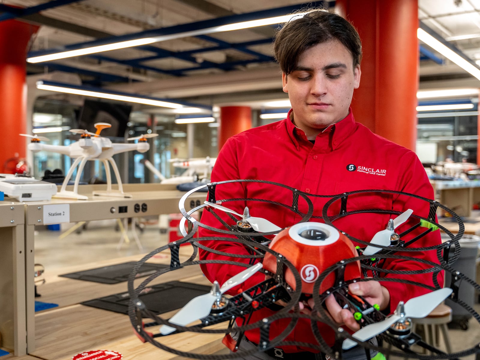 Sinclair Community College UAS bachelor’s degree graduate Alexander Catalan works with a drone in the National UAS Training and Certification Center at the Dayton campus. CONTRIBUTED