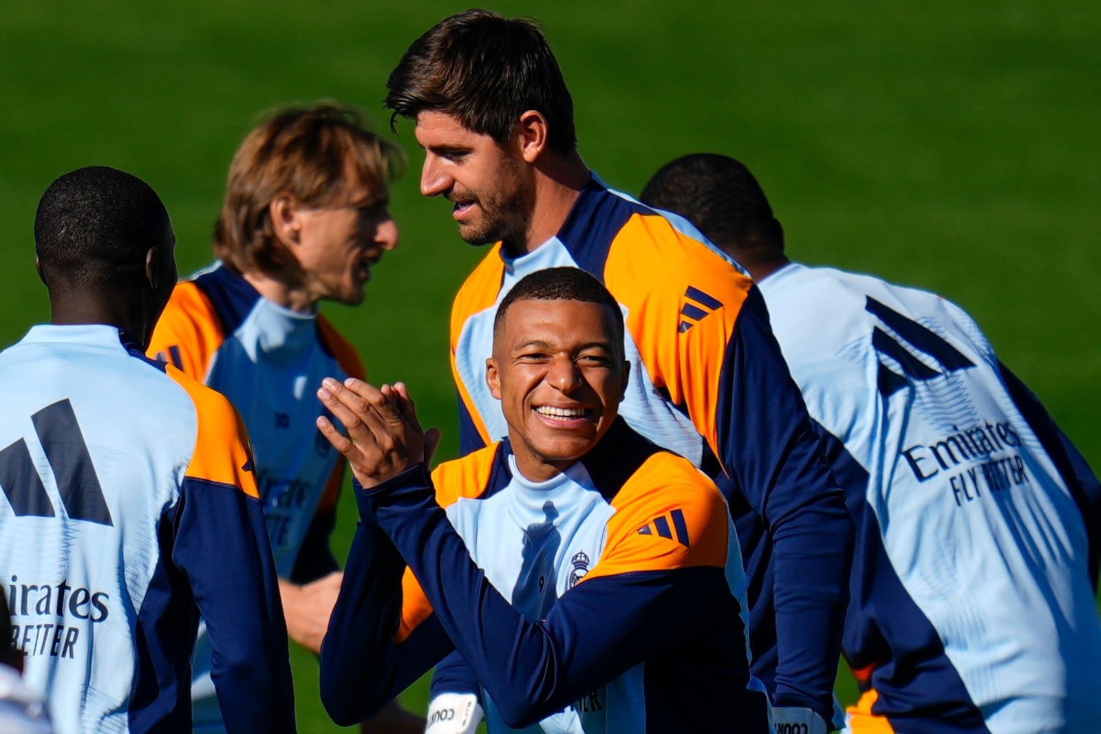 Real Madrid's Kylian Mbappe, center, gestures during a training session with his teammates at Real Madrid's Valdebebas training ground in Madrid, Spain, Friday, Oct. 18, 2024. (AP Photo/Manu Fernandez)