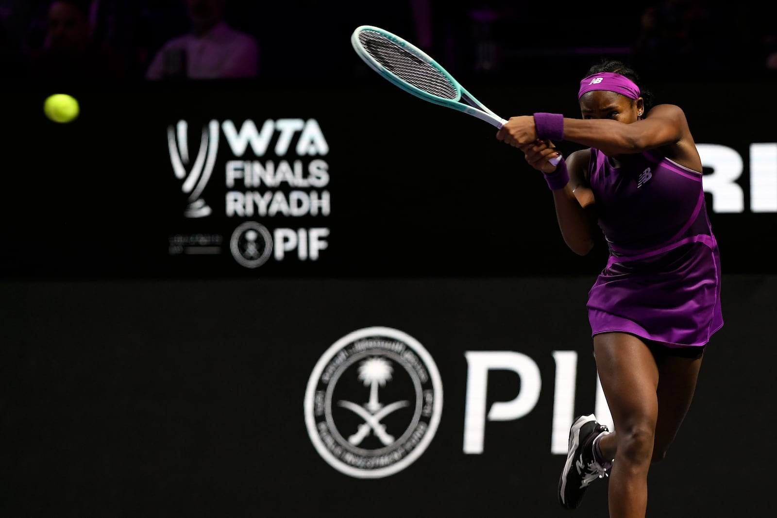 Coco Gauff of the U.S. plays a shot against China's Qinwen Zheng during their women's singles final match of the WTA finals at the King Saud University Indoor Arena, in Riyadh, Saudi Arabia, Saturday, Nov. 9, 2024. (AP Photo)