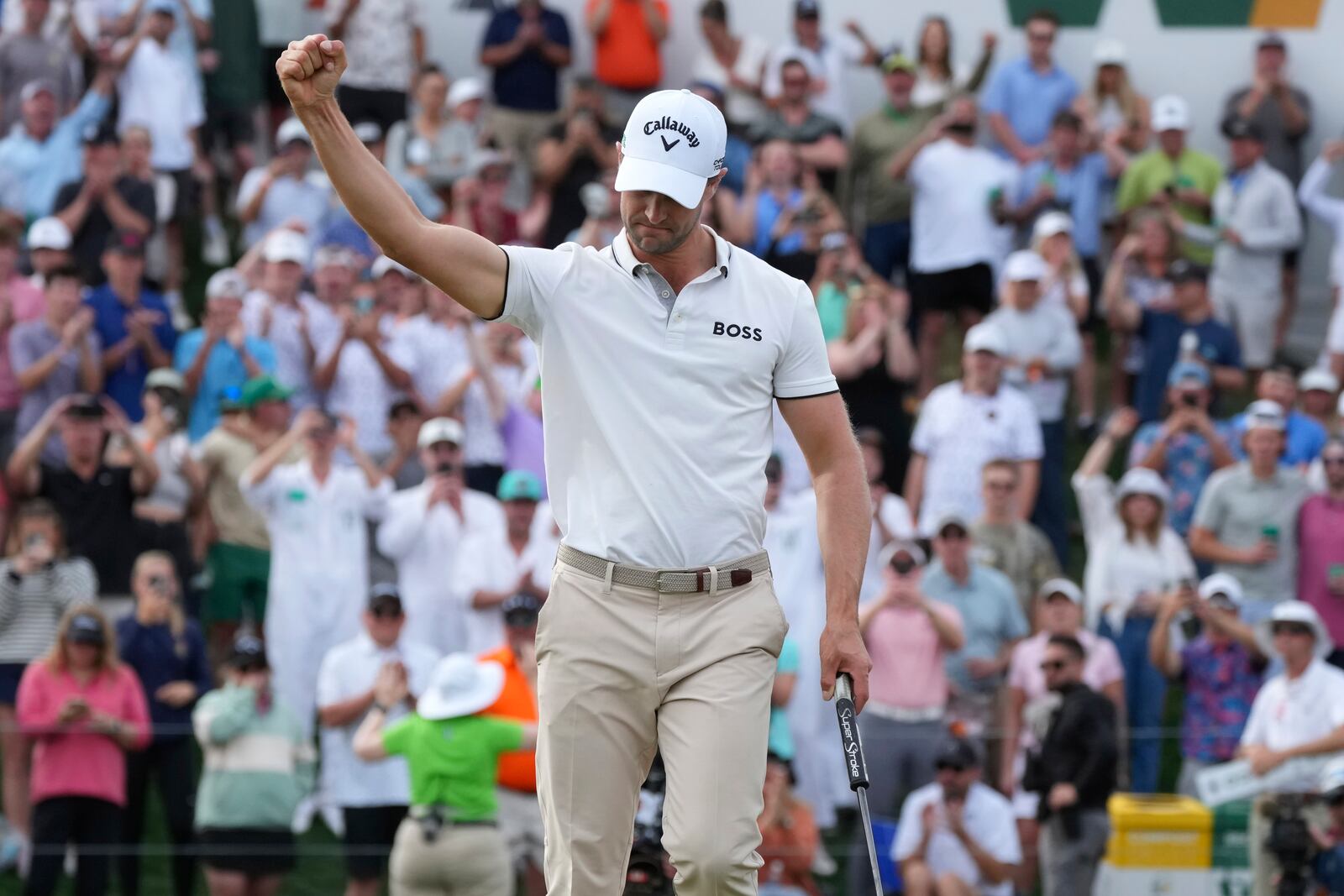 Thomas Detry, of Belgium, pumps his fist after sinking a birdie putt on the 18th hole to win the Phoenix Open golf tournament at TPC Scottsdale, Sunday, Feb. 9, 2025, in Scottsdale, Ariz. (AP Photo/Ross D. Franklin)