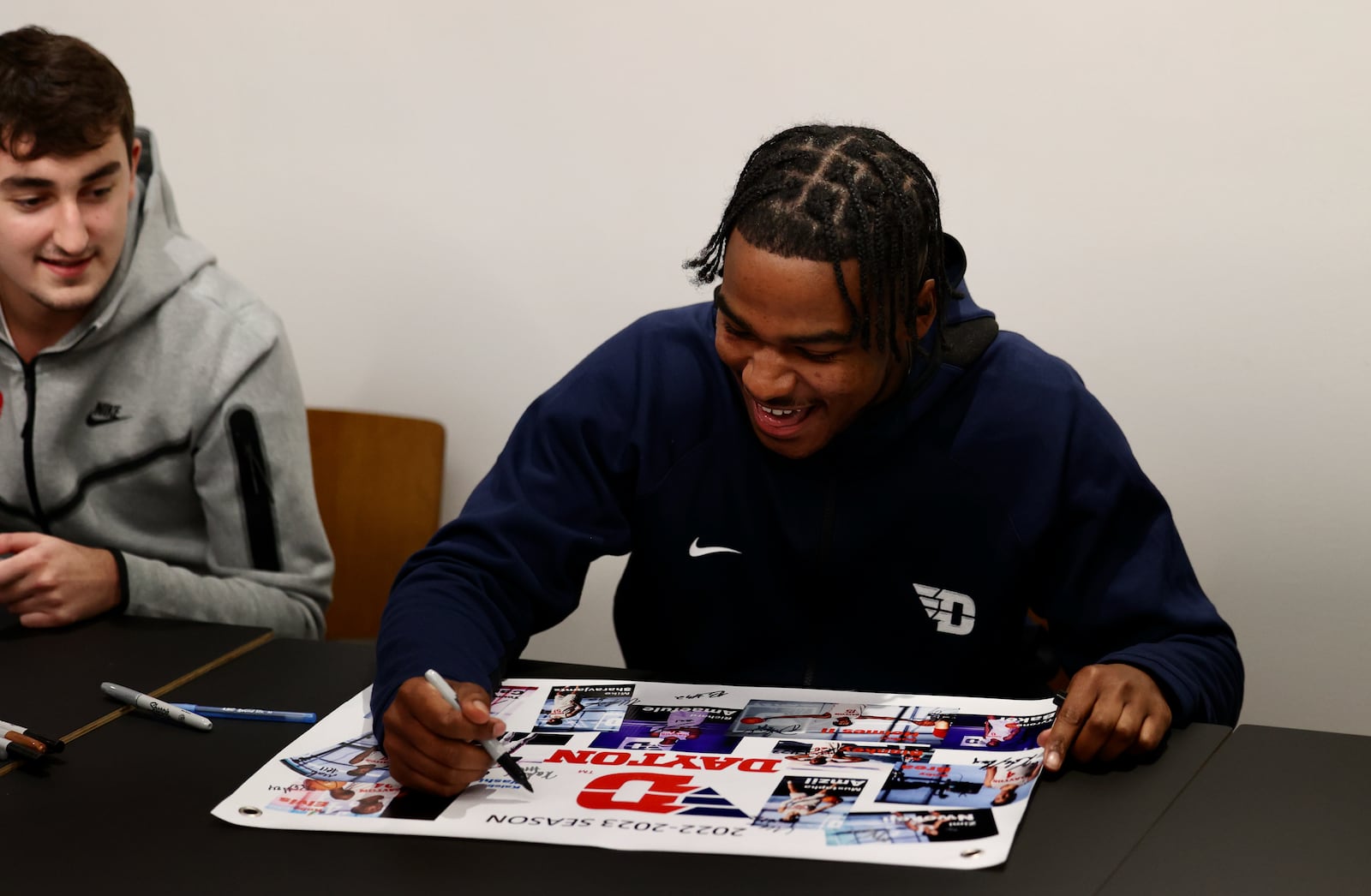 Dayton walk-on Ty Locklear signs autographs before the Red & Blue Game on Saturday, Oct. 15, 2022, at UD Arena. David Jablonski/Staff