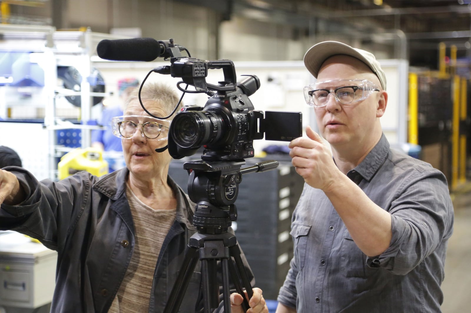 “American Factory” directors Julia Reichert (left) and Steven Bognar filming scenes at Fuyao. DAVID HOLM/NETFLIX