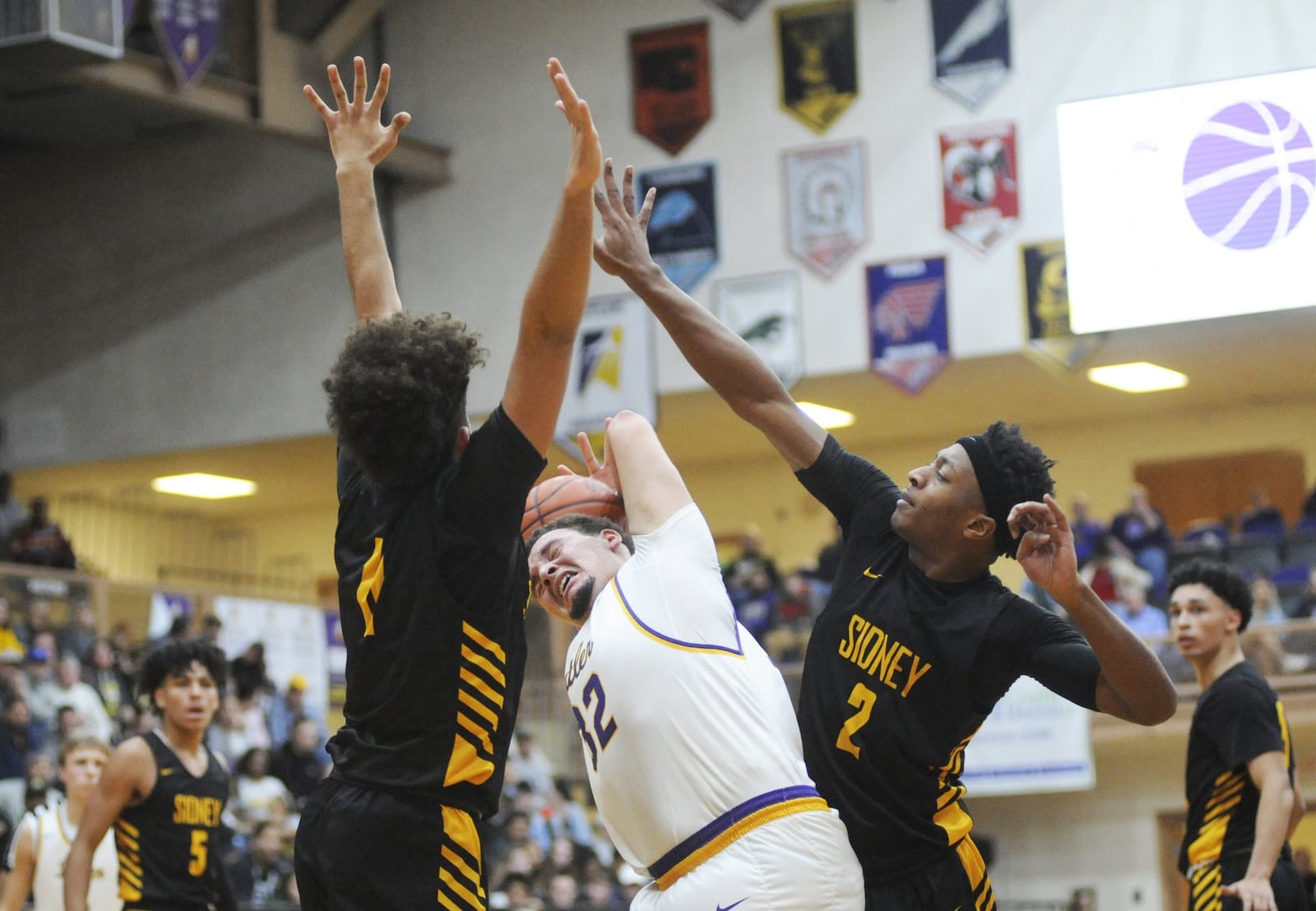 Butler’s Quenton Glover (with ball) is covered by Sidney’s Keith Lee (left) and Ratez Roberts. Sidney defeated host Butler 51-46 in OT in a boys high school basketball game on Tuesday, Dec. 18, 2018. MARC PENDLETON / STAFF