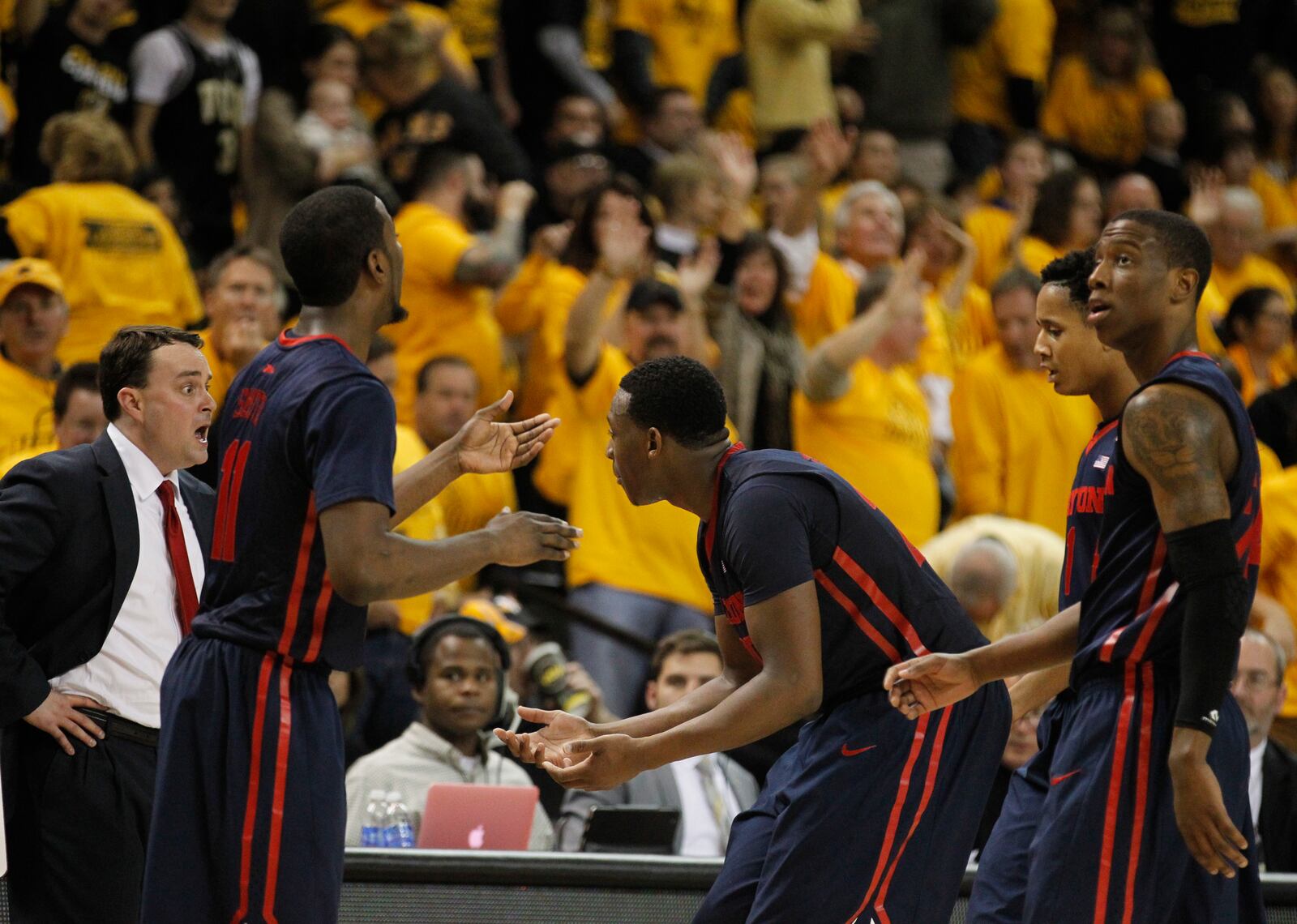 Dayton coach Archie Miller, left, reacts after Kendall Pollard, center, fouled out against Virginia Commonwealth on Saturday, Feb. 28, 2015, at the Siegel Center in Richmond, Va. David Jablonski/Staff