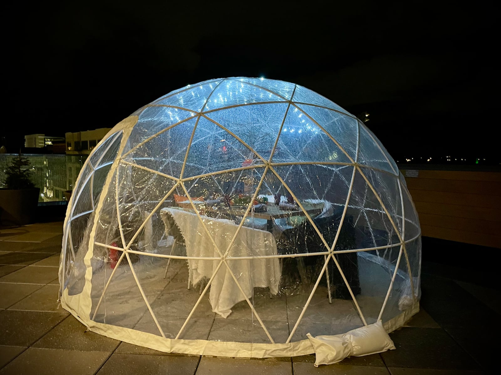 The Foundry, located on the sixth floor of AC Hotel Dayton, has brought back its igloo rooftop dining experience with views of Day Air Ballpark and the Dayton skyline. NATALIE JONES/STAFF