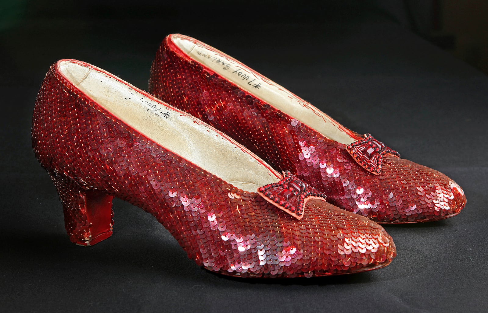 FILE - Sequin-covered ruby slippers worn by Judy Garland in "The Wizard of Oz" appear at the offices of Profiles in History in Calabasas, Calif. on Nov. 9, 2001. (AP Photo/Reed Saxon, File)