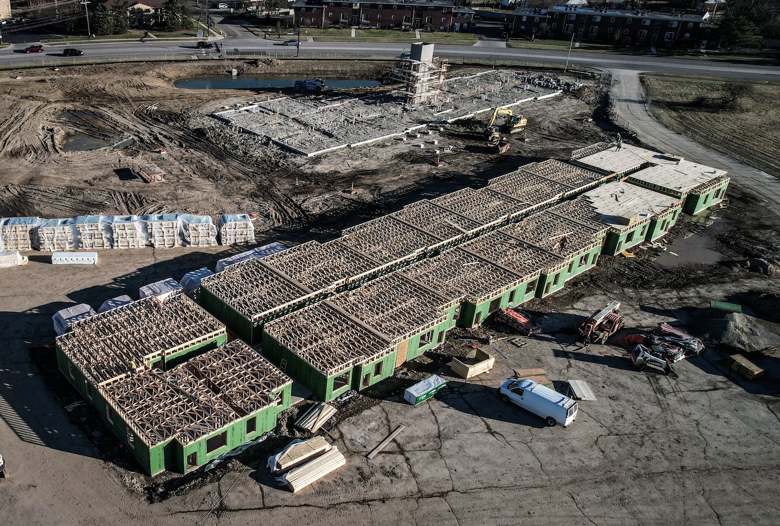 Work continues on the Lofts at Kettering Town Center and the Senior Village at Kettering Town Center on Woodman Drive in Kettering. JIM NOELKER/STAFF