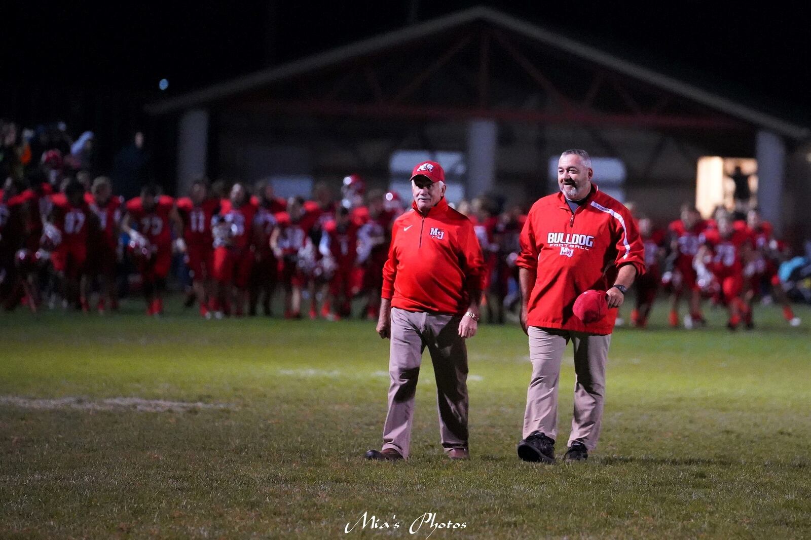 Bret Pearce (right) and his dad Joe walk across the field in West Milton last week after Milton Union’ 35-0 victory over Dohn Community High. Joe, who lives in Mansfield, comes to every game. Mia Richardson/Mia’s Photos