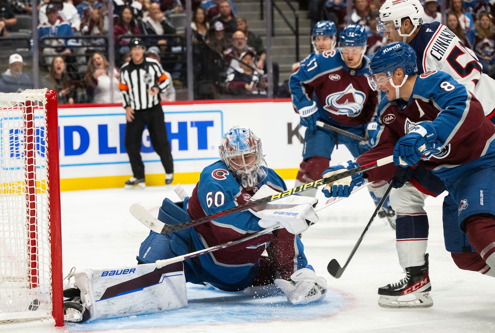 Columbus Blue Jackets right wing Yegor Chinakhov (59) scores against Colorado Avalanche goaltender Justus Annunen (60) during the second period of an NHL hockey game, Saturday, Oct. 12, 2024, at Ball Arena in Denver. (Christian Murdock/The Gazette via AP)