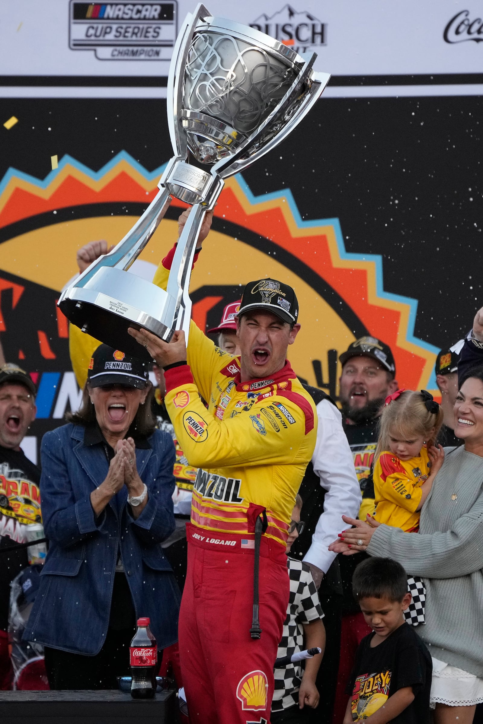 Joey Logano celebrates after winning a NASCAR Cup Series Championship auto race for the championship at Phoenix Raceway, Sunday, Nov. 10, 2024, in Avondale, Ariz. (AP Photo/John Locher)