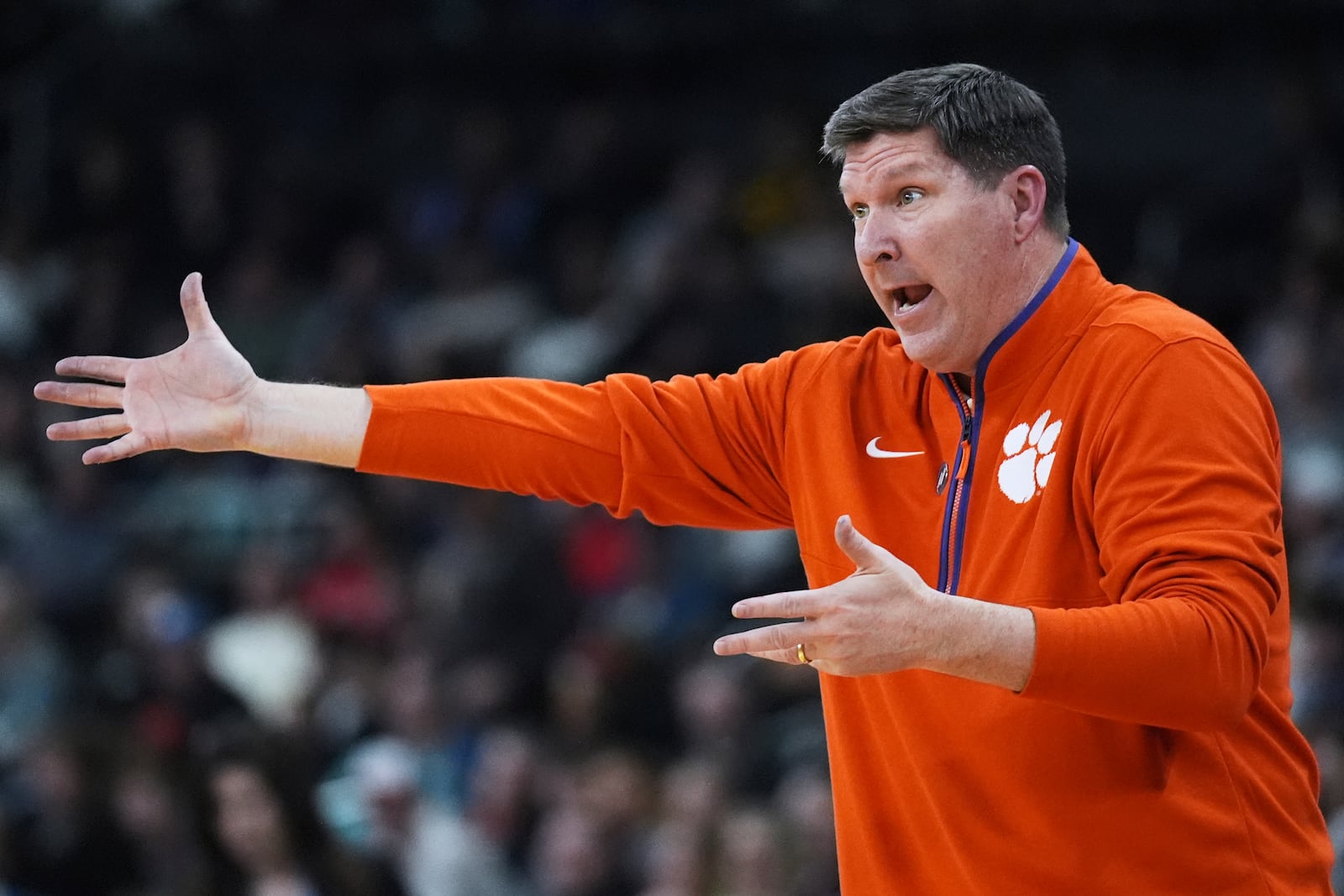 Clemson head coach Brad Brownell calls to his players during the first half in the first round of the NCAA college basketball tournament, Thursday, March 20, 2025, in Providence, R.I. (AP Photo/Charles Krupa)