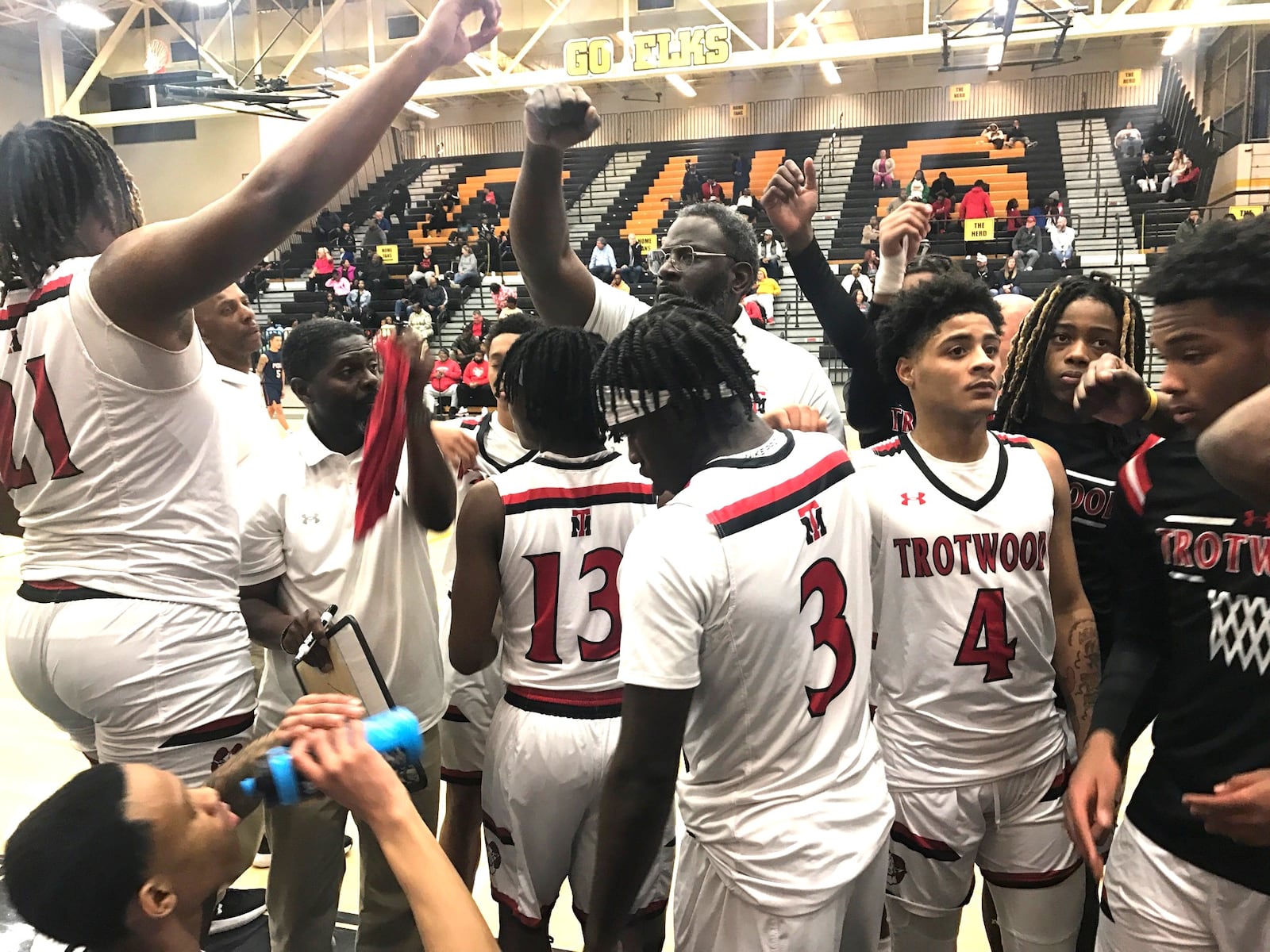 Trotwood Madison coach Carl Blanton Sr. pumps up his team during a time out in their 79-22 Division III District Semifinal victory over Piqua Tuesday night at Centerville. Tom Archdeacon/CONTRIBUTED