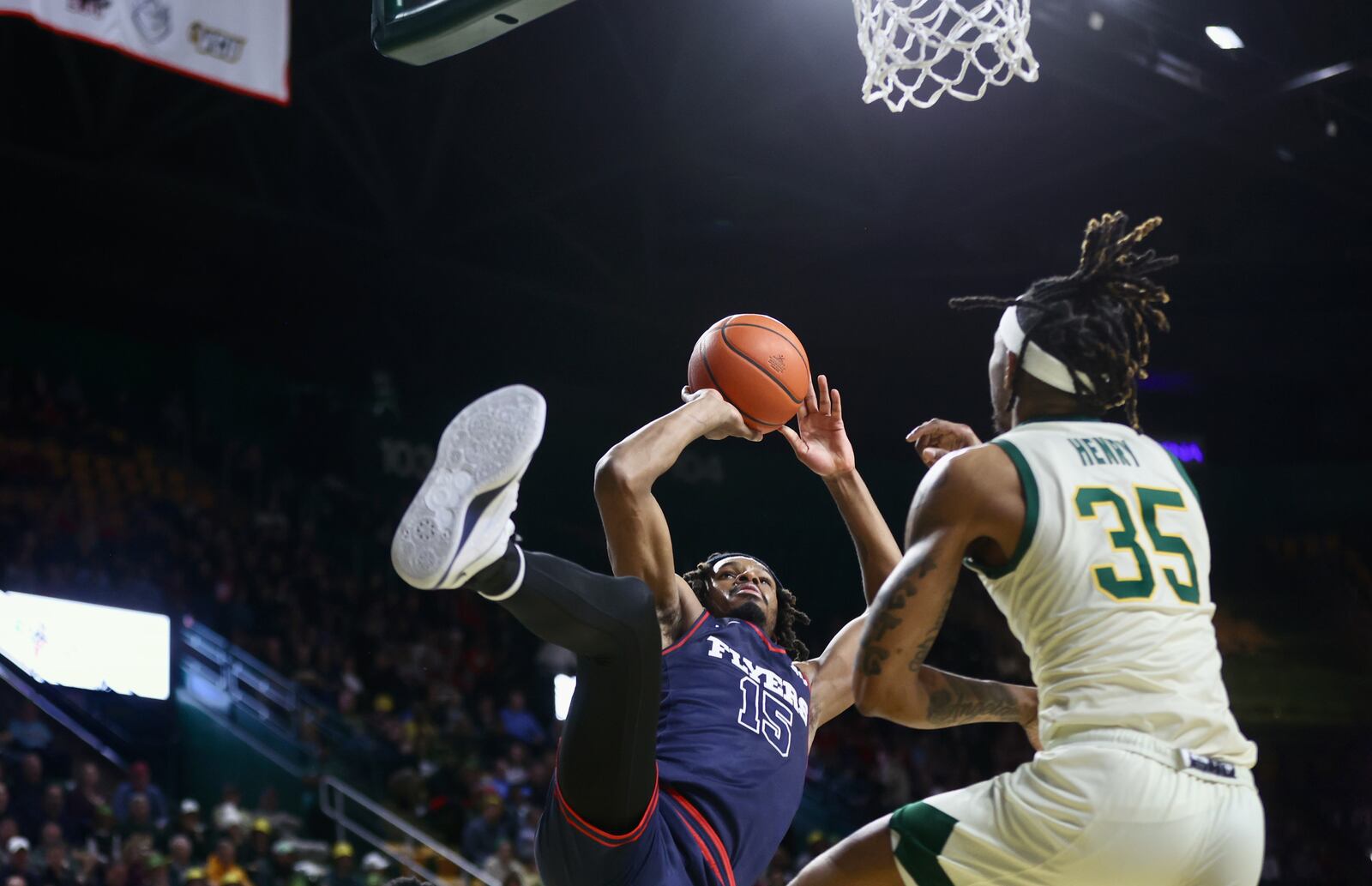 Dayton's DaRon Holmes II scores as he's fouled in the first half against George Mason on Wednesday, Feb. 21, 2024, at EagleBank Arena in Fairfax, Va. He completed the 3-point play. David Jablonski/Staff