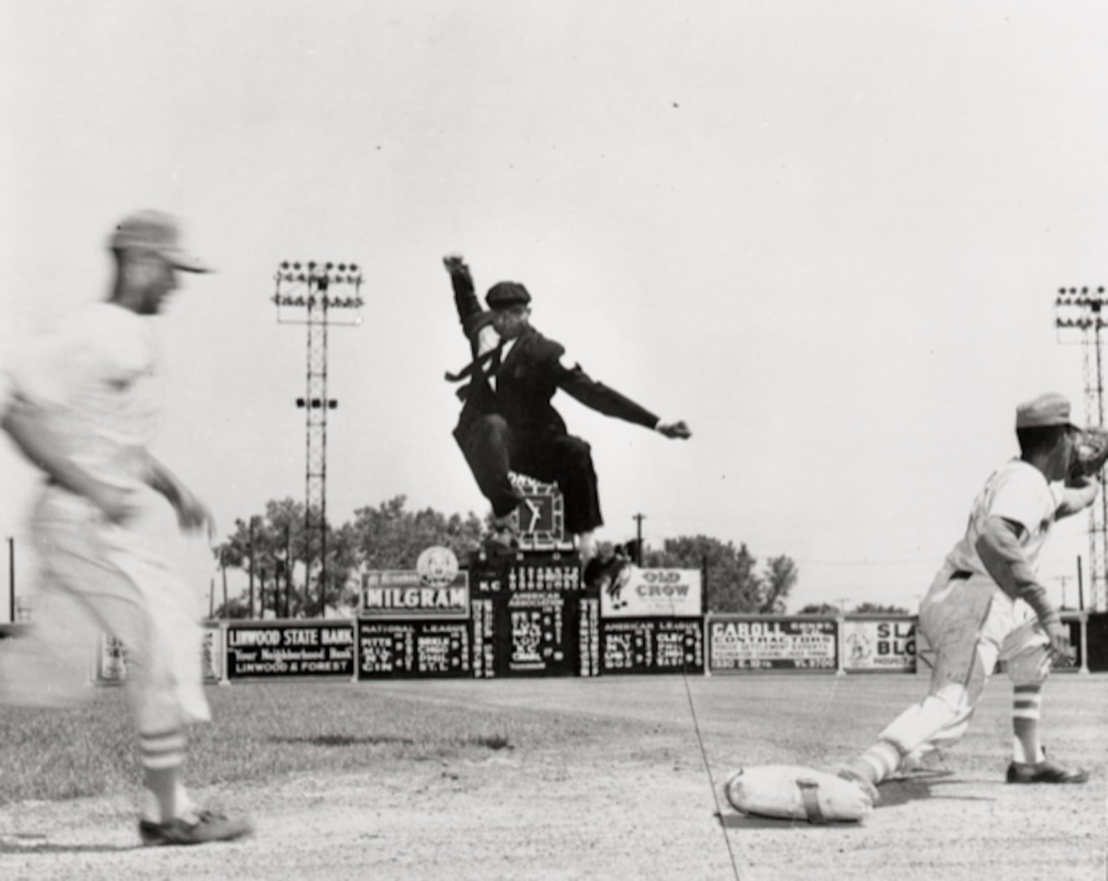 Umpire Bob Motley in the air. Motley, who moved to Dayton from the south, and his son Byron Motley are authors of “The Negro Baseball Leagues.” Byron Motley helped produce and narrate "The League," a documentary that opens at The Neon in downtown Dayton July 14. CONTRIBUTED.