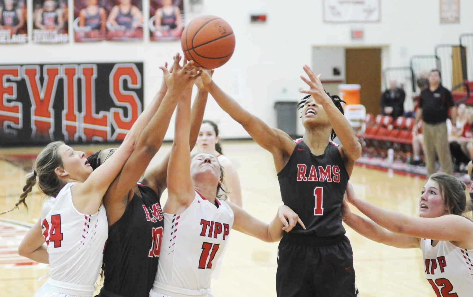 Trotwood’s Quantaijah Huffman (1) rises above (left) Kendall Clodfelter (24), Heaven Gooden (10), Jillian Brown (11) and Brooke Aselage (12) for a rebound. Trotwood-Madison defeated host Tippecanoe 37-35 in girls high school basketball on Thursday, Jan. 24, 2019. MARC PENDLETON / STAFF