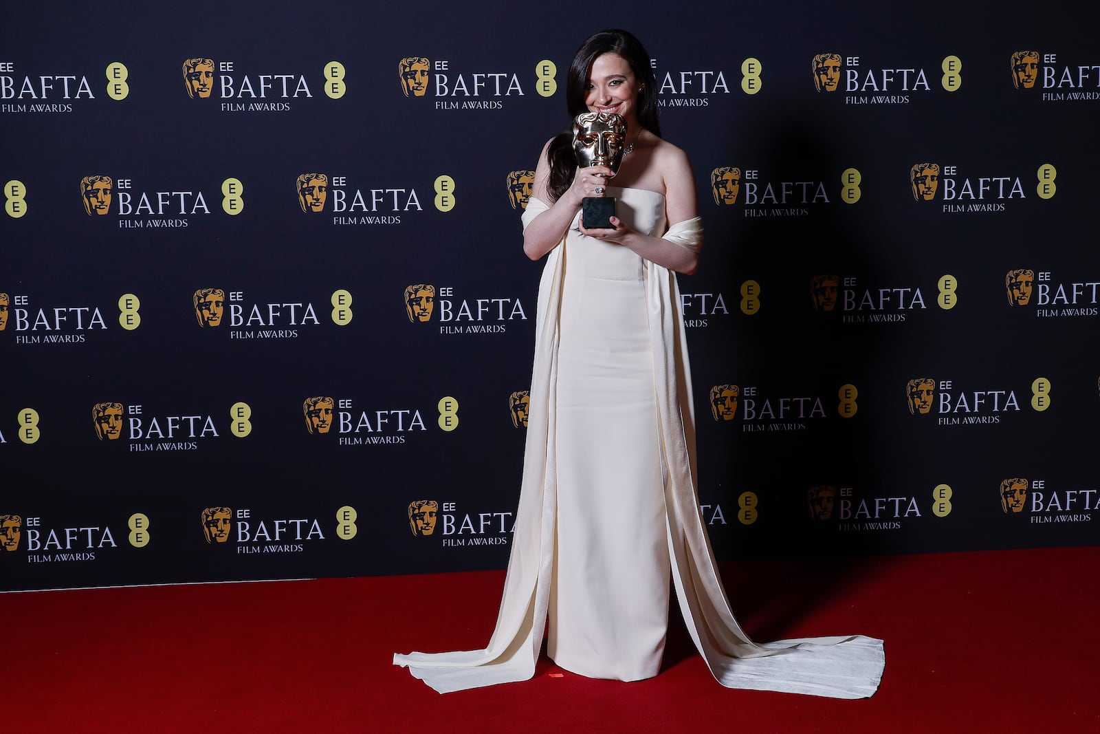 Mikey Madison poses with the leading actress award for 'Anora' at the 78th British Academy Film Awards, BAFTA's, in London, Sunday, Feb. 16, 2025. (Photo by Joel C Ryan/Invision/AP)