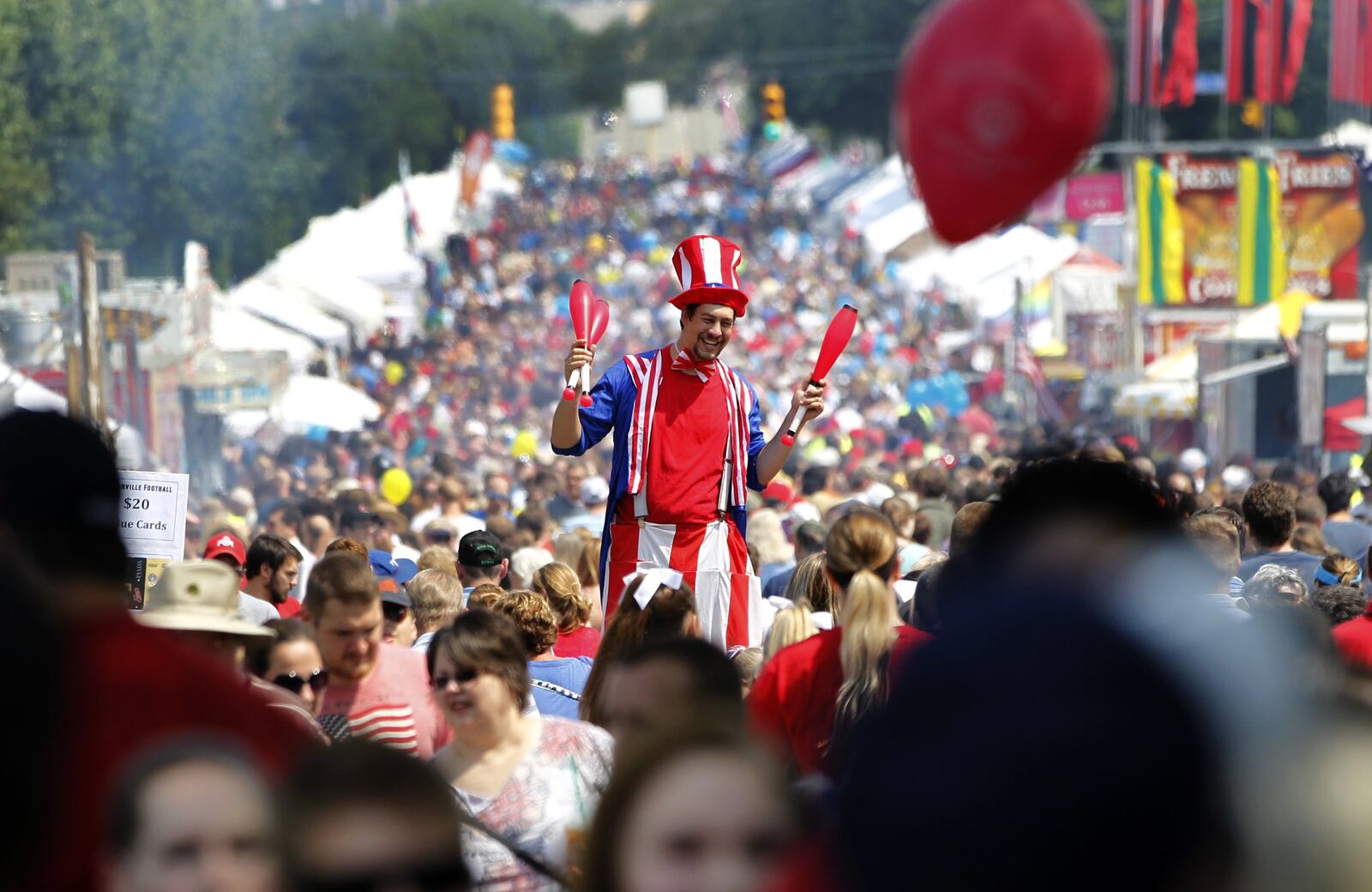 Centerville’s Americana Festival parade makes its way down West       Franklin Street Saturday. The festival, which was expected to       draw over 75,000 people, featured the parade with over 120 units,       a 5K run, a street fair and fireworks. LISA POWELL / STAFF