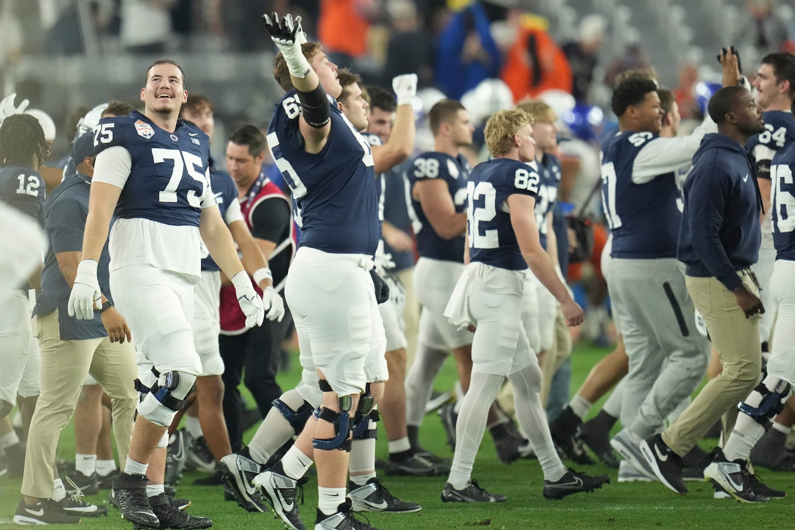 Penn State players celebrate after the Fiesta Bowl College Football Playoff game against Boise State, Tuesday, Dec. 31, 2024, in Glendale, Ariz. (AP Photo/Ross D. Franklin)