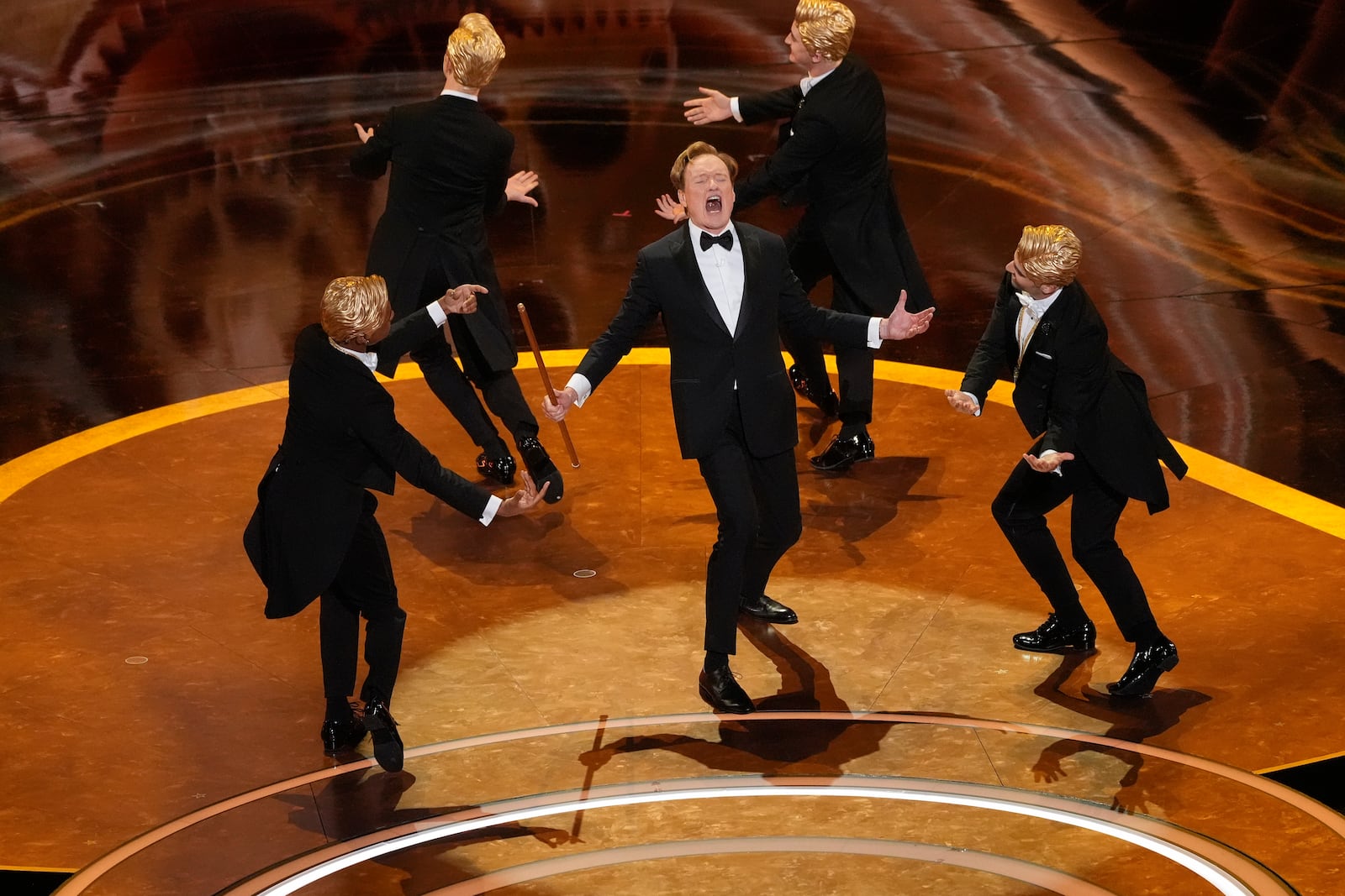 Host Conan O'Brien, center, performs during the Oscars on Sunday, March 2, 2025, at the Dolby Theatre in Los Angeles. (AP Photo/Chris Pizzello)