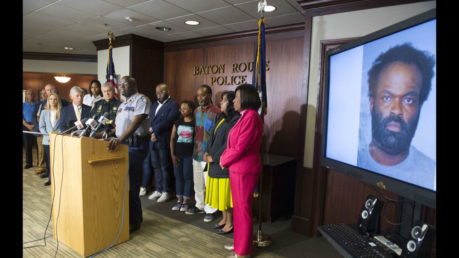 Baton Rouge police Chief Murphy Paul, at lectern, on Tuesday announces the arrest of Ronn Bell Sr., shown on monitor at right, in the July 12 slaying of community activist and Baton Rouge African-American History Museum founder Sadie Roberts-Joseph.