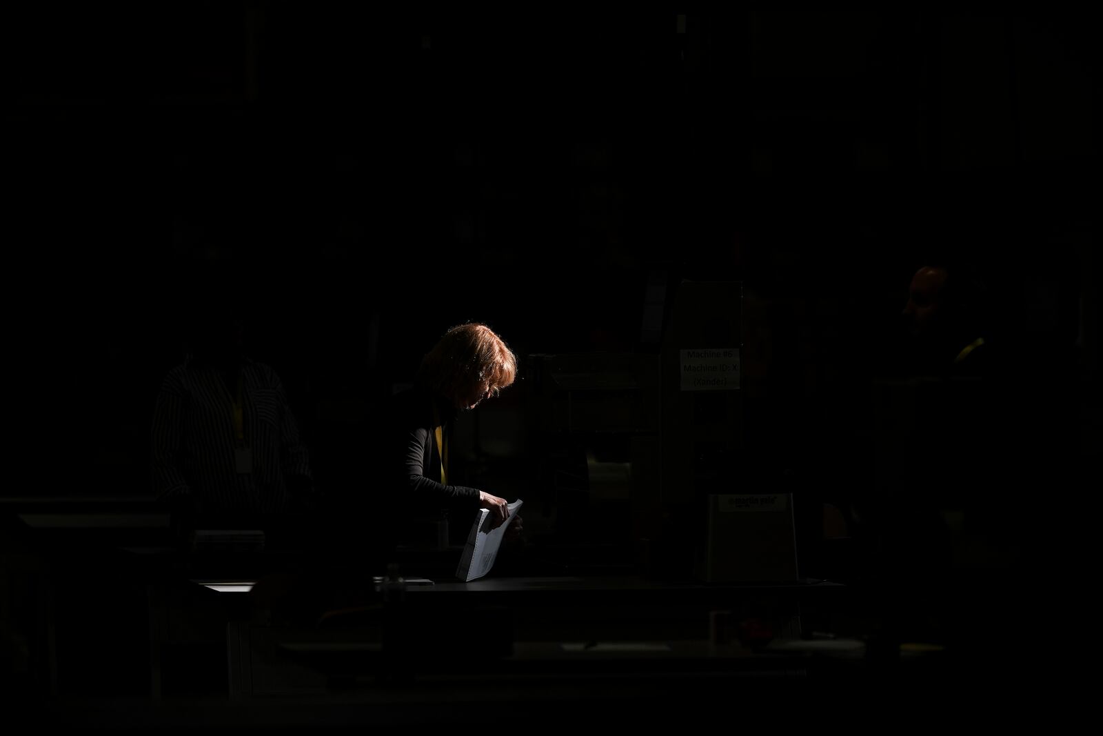 An election worker processes mail-in ballots for the 2024 General Election at the Philadelphia Election Warehouse, Tuesday, Nov. 5, 2024, in Philadelphia. (AP Photo/Matt Slocum)